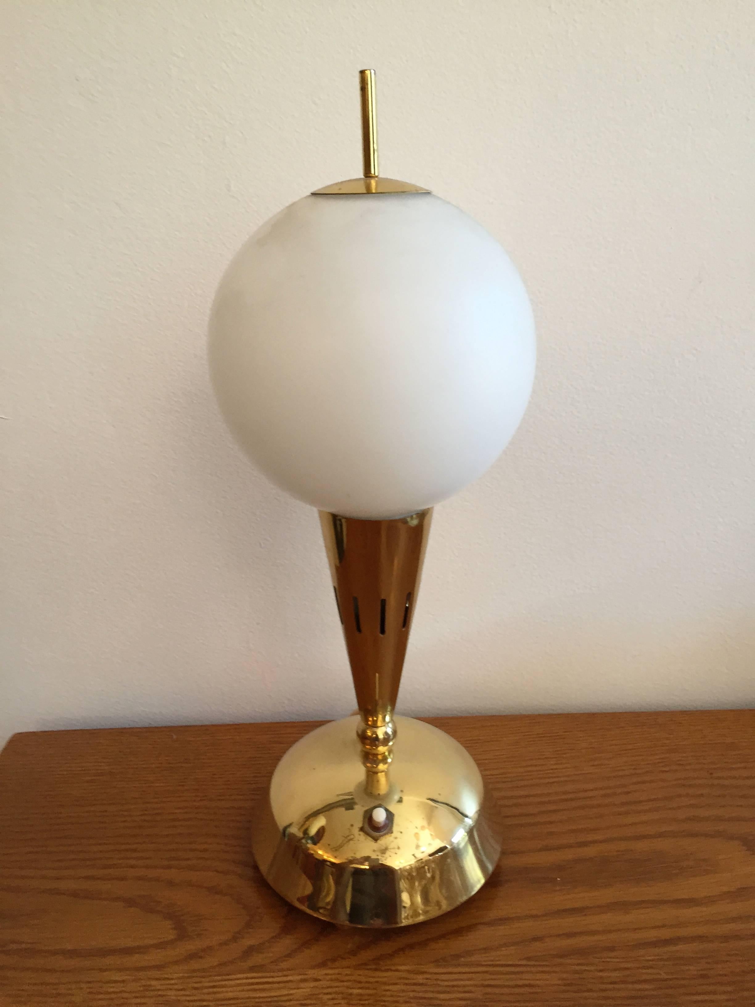 A wonderful pair of 1950s Italian brass table lamps with white glass globe shades. Rewired.