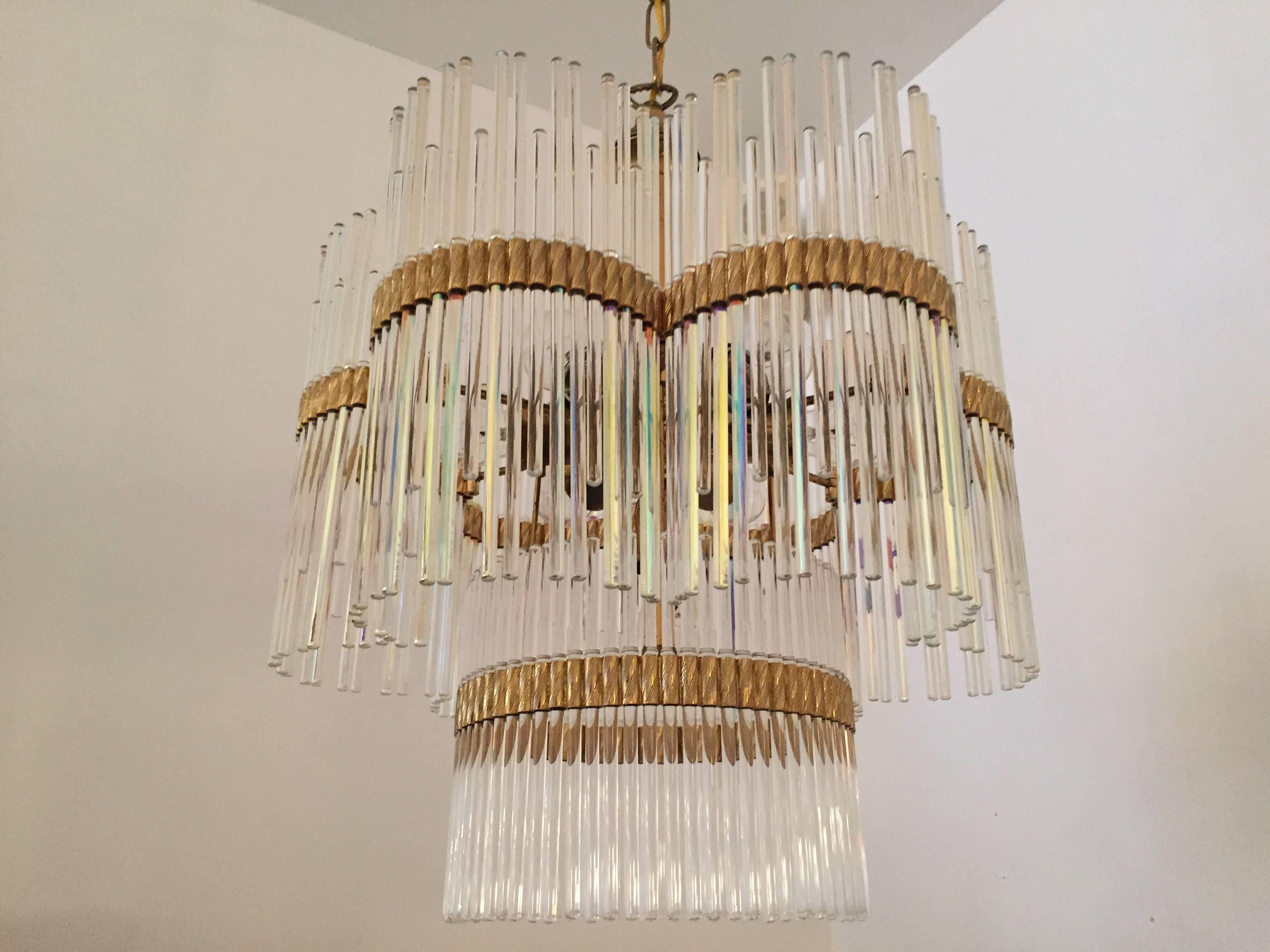 A great original 1960s Italian pendant chandelier by the famed lighting company, Sciolari. The chandelier is composed of a light gold and brass frame with clear prism rods fashioned in a glamorous Art Deco style. Seven-light sources. Fixture height-