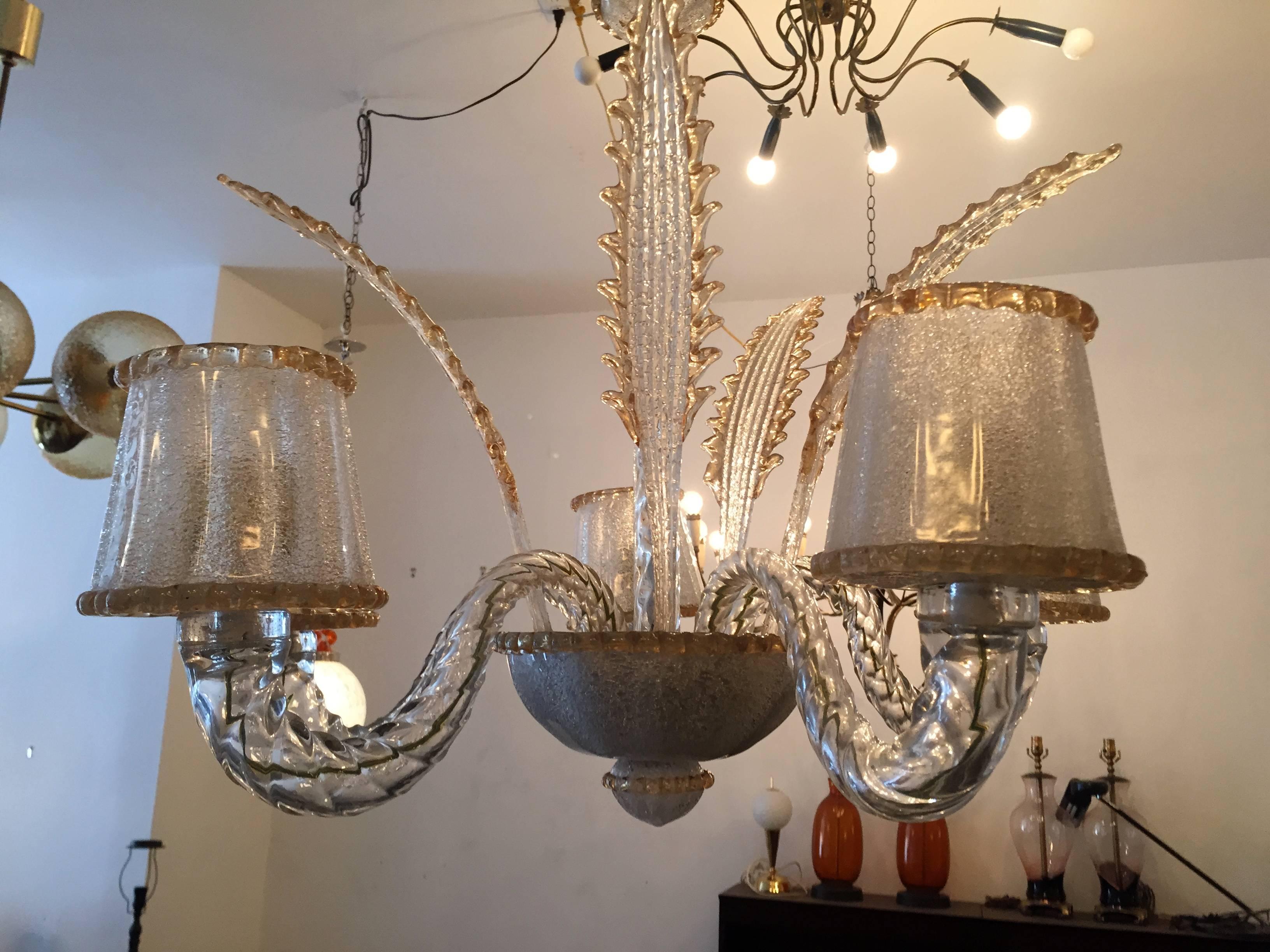 A wonderful handblown Murano glass chandelier composed of five arms, leaves and shades in lights white/clear bubbled glass with a gold infused accents by the famed glass company, Barovier. Rewired with canopy.