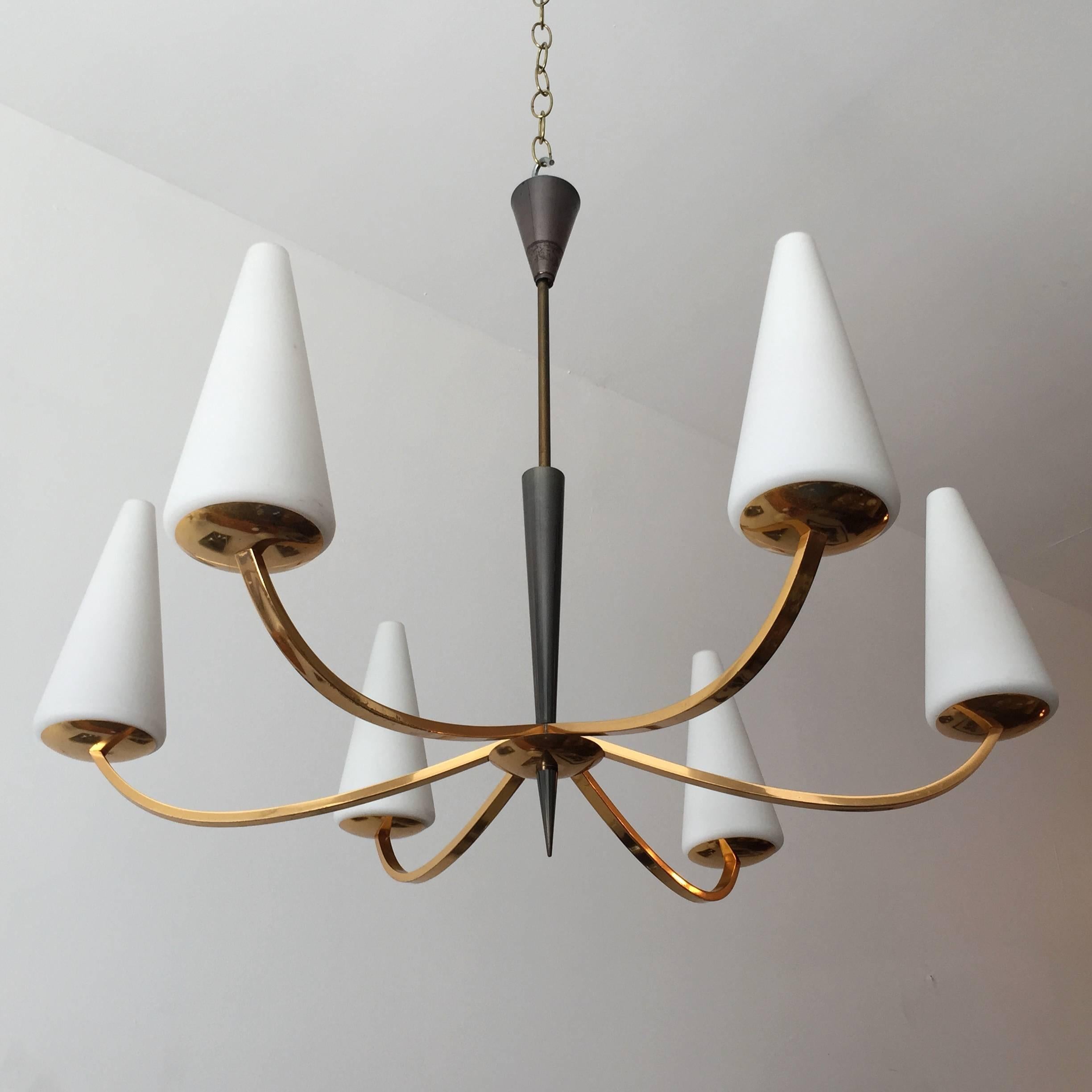 An original 1960s French modern chandelier composed of a golden brass and gun metal enamel body with white matte glass cone shades. Newly rewired.