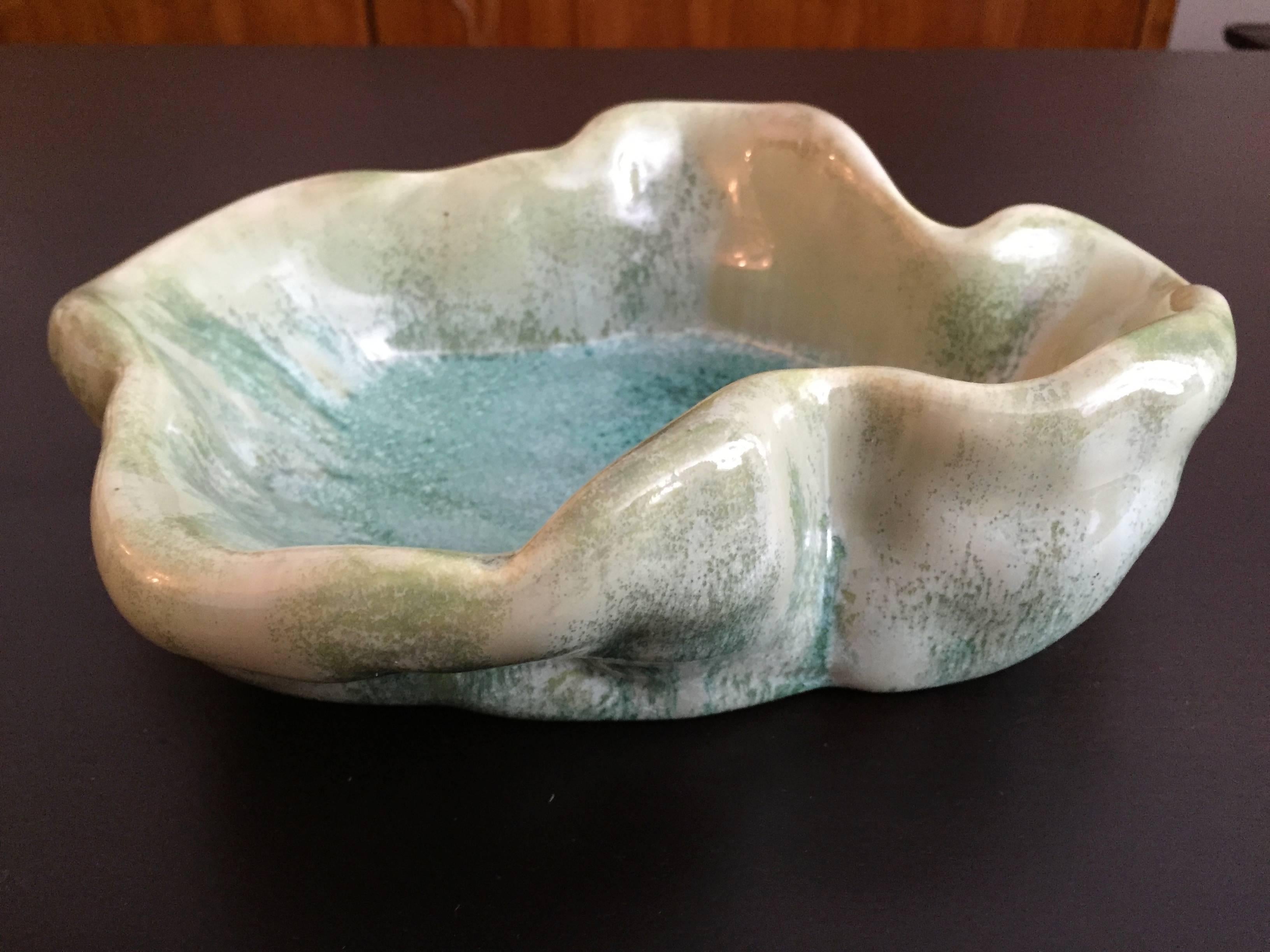 An original 1950s pale green with a slight crystalline glaze bowl by famed Italian artist, Antonia Campi. Signed.