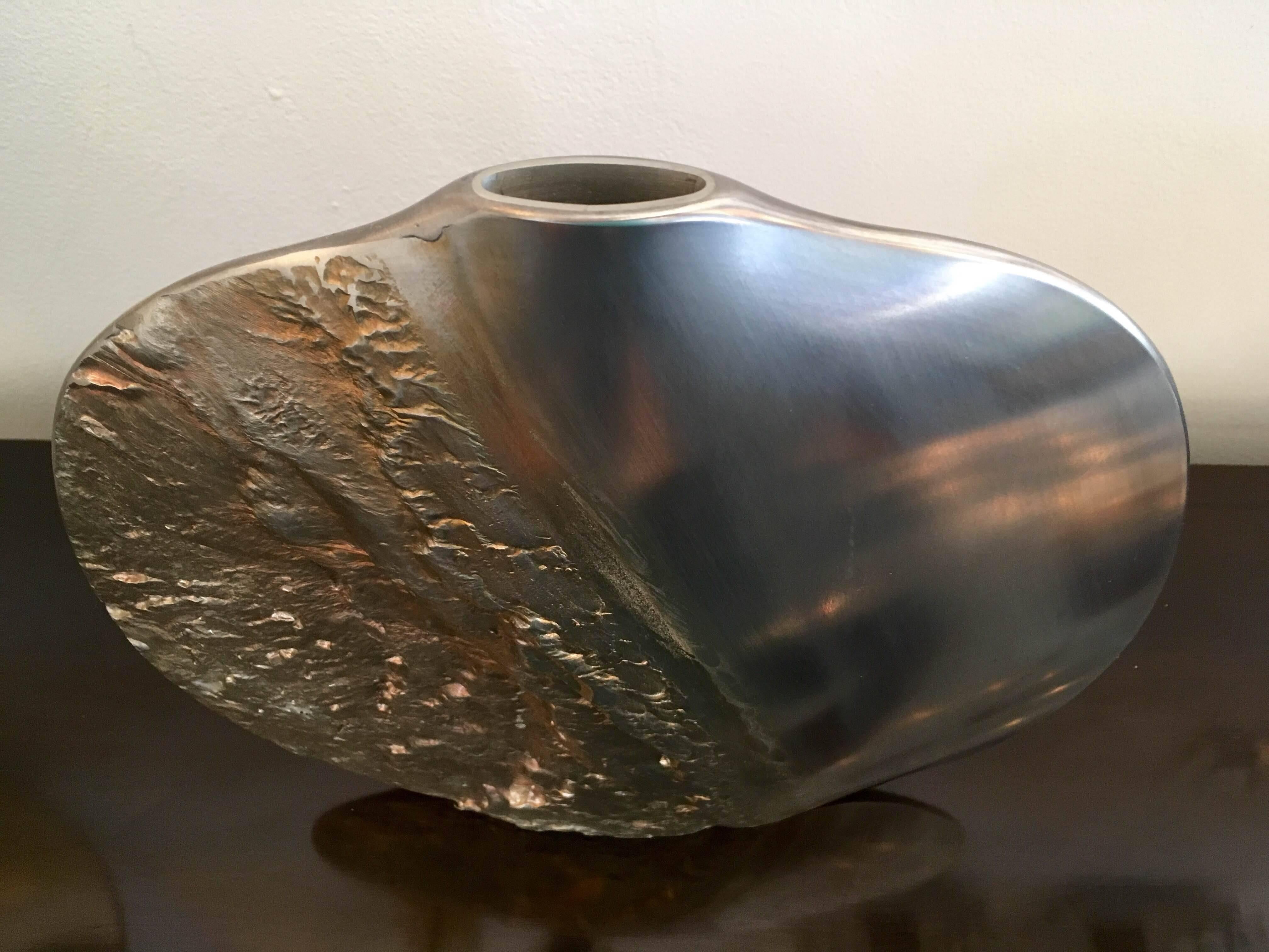 A great signed 1983 sculptural textured pewter vase by Norwegian artist, Helgi Joensen for Illums Bolighus.

Helgi Joensen was raised on the Faroe Islands and the western coast of Norway where he was exposed to the spectacular and ever changing
