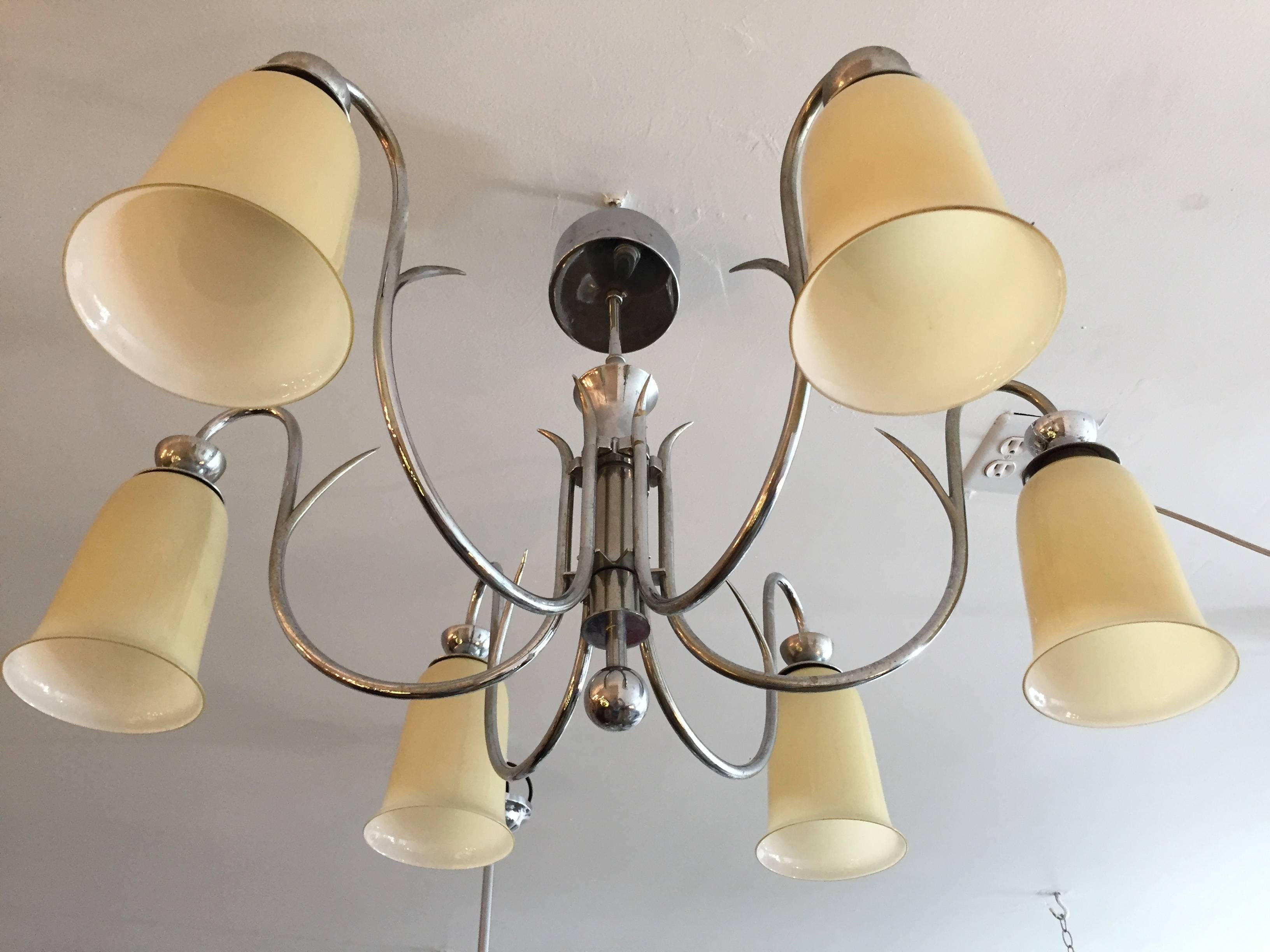 A wonderful 1920s Austrian Art Deco chandelier or flush ceiling light composed of a chrome body and custard glass shades. It has nice sweeping arms with decorative vine and ball elements. Newly rewired.