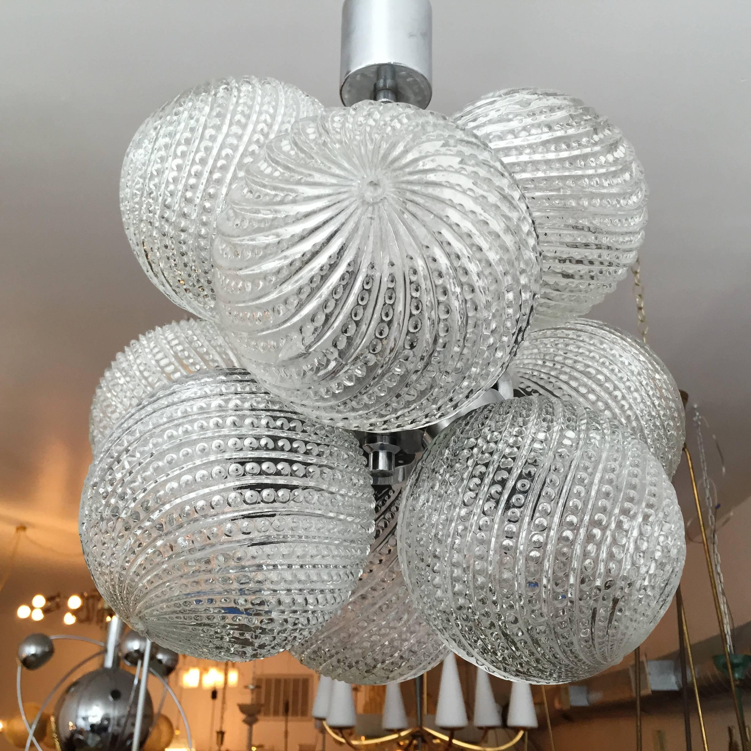 A great 1960s pendant composed of a chrome body and nine large decorative glass globe shades. Newly rewired.