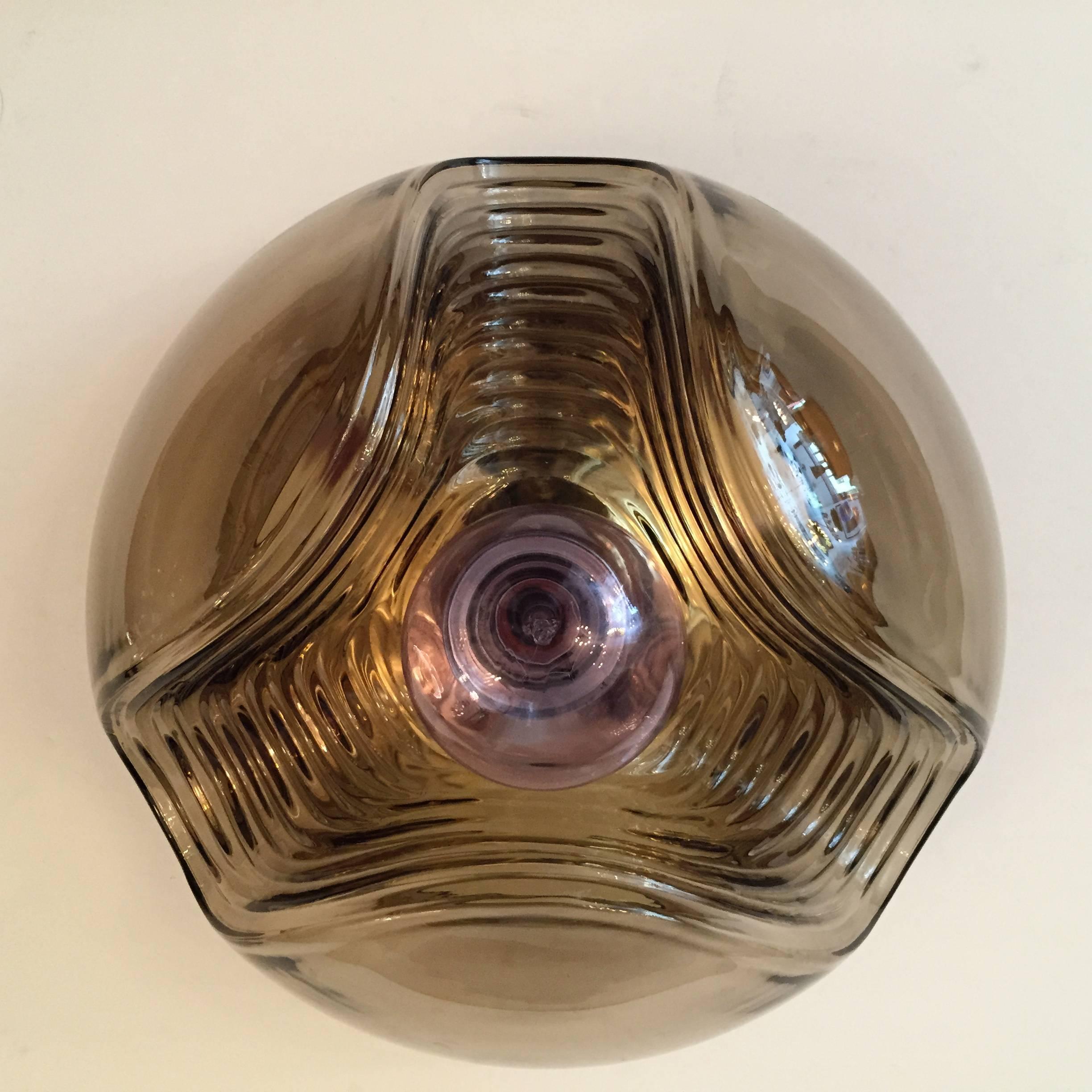 A great pair of original 1960s lightly smoked glass Space Age wall or ceiling lights by Peill and Putzler. Gold reflective back plates. Newly rewired.