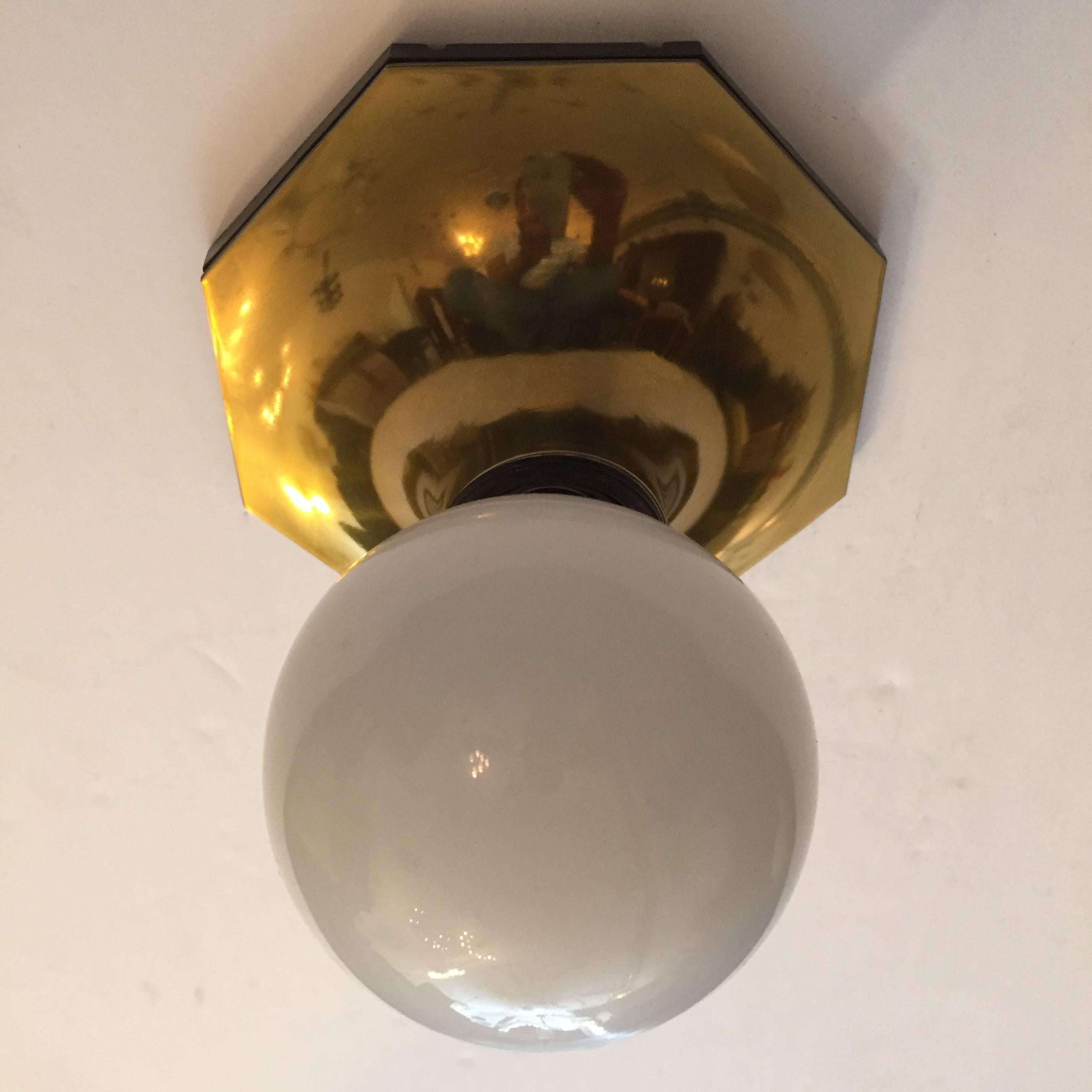 A set of 1960s Space Age flush ceiling lights or wall sconces in a high polish gold enamel by Motoko Ishii for Staff. Standard sockets. Newly rewired.