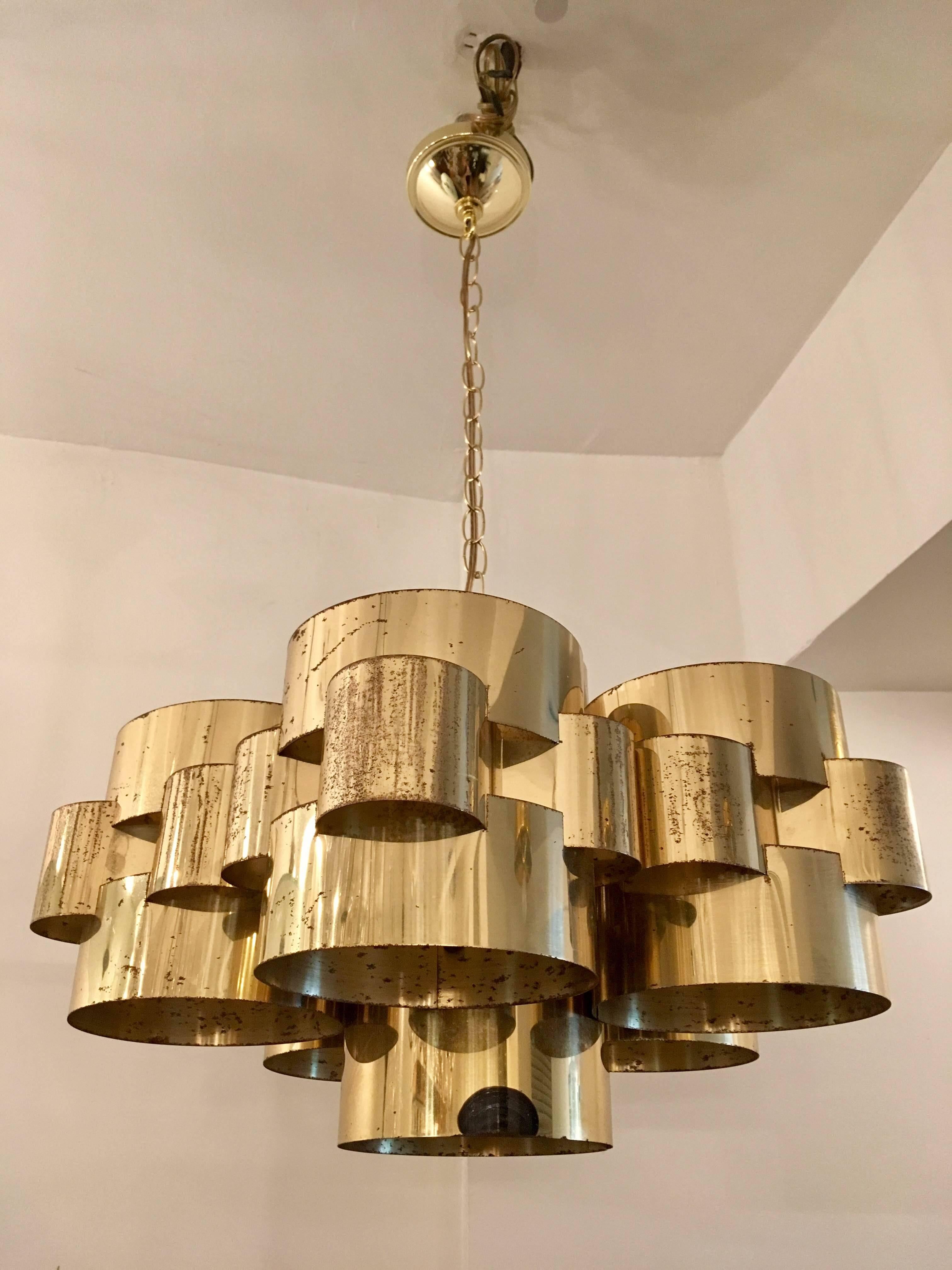 An original 1960s cloud pendant by Curtis Jere composed of circular polished brass components. Newly rewired. Original finish with pitting to the brass. We will include a new polish if desired. Signed.