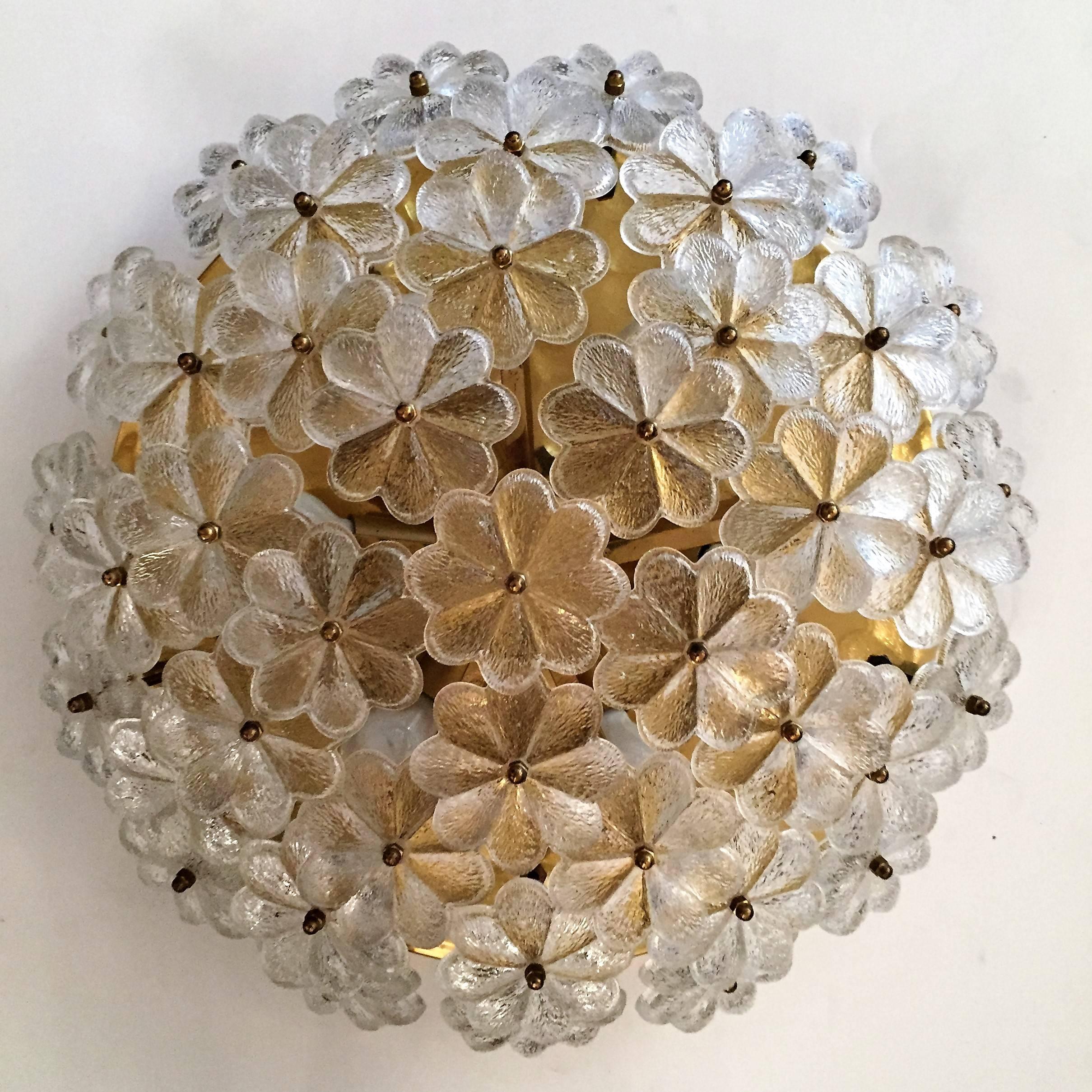 A wonderful 1960s Austrian flush ceiling light composed of a golden brass fixture holding 42 floral glass elements. Six-light sources. Newly rewired.