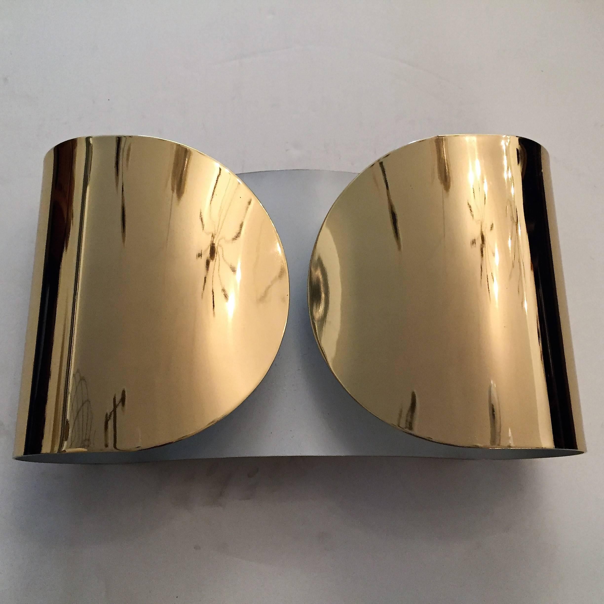 A great pair of oversized polished mirror brass and white enamel sconces by Tobia Scarpa for Flos, circa 1960. Two light sources. Rewired.