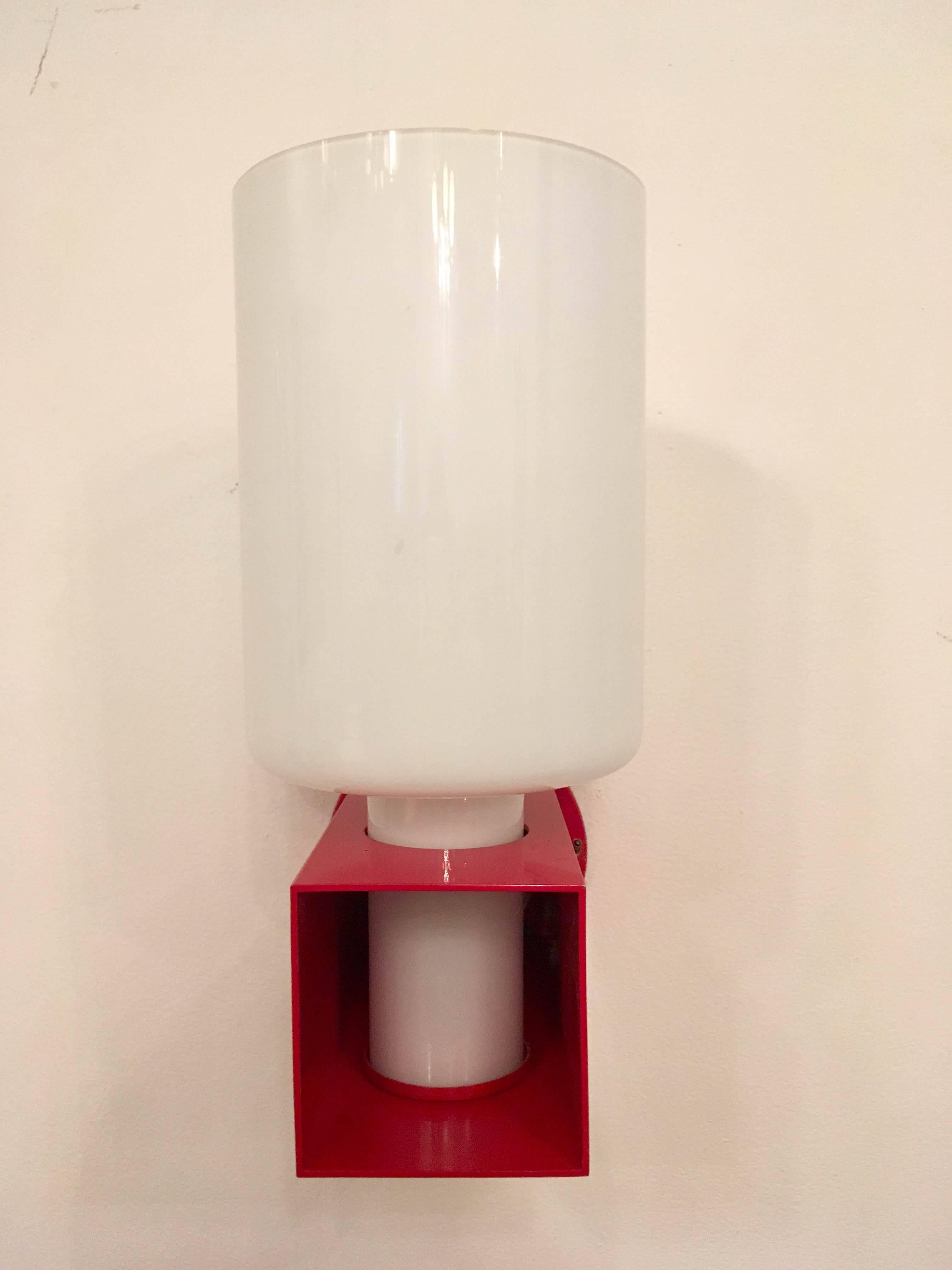 A pair of Italian 1980s sconces composed of red enamel box frames holding white opaline glass shades. Newly rewired.