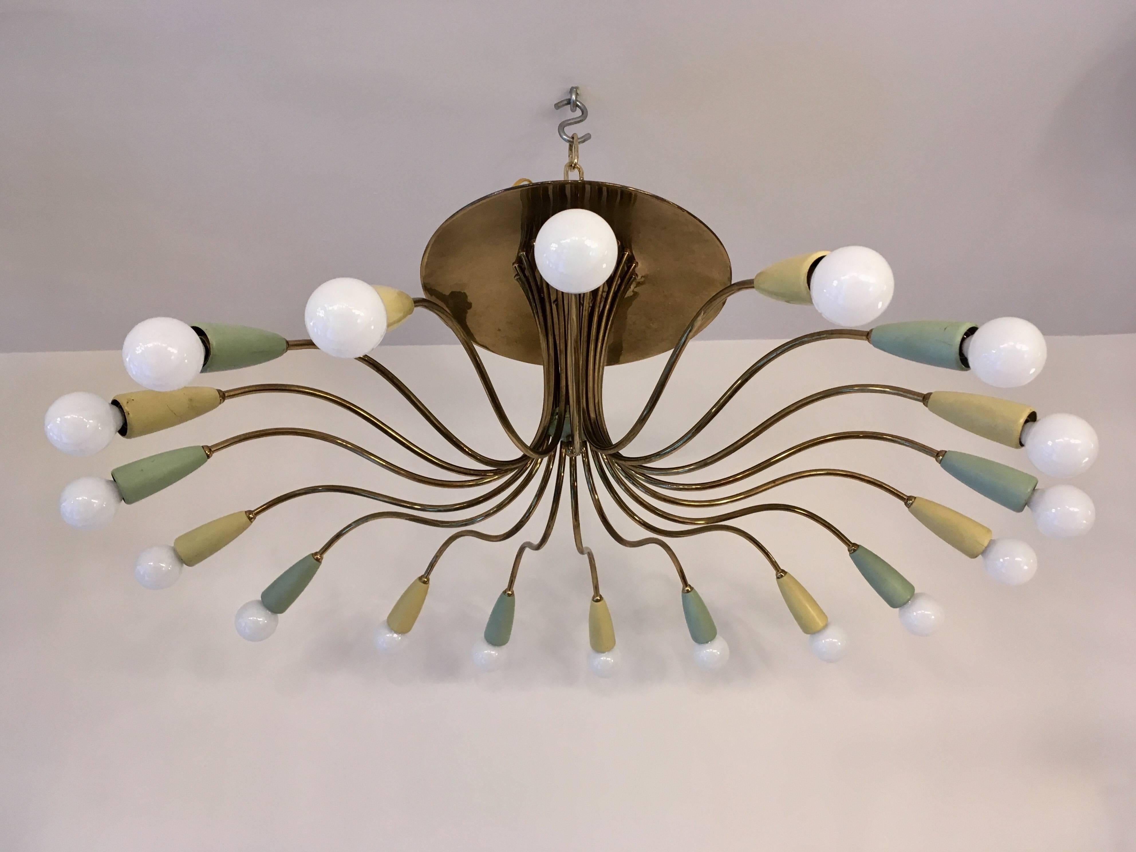 An original 1950s Italian chandelier or flush ceiling light with swooping aged brass arms and colored enamel shades. Original. Newly Rewired.