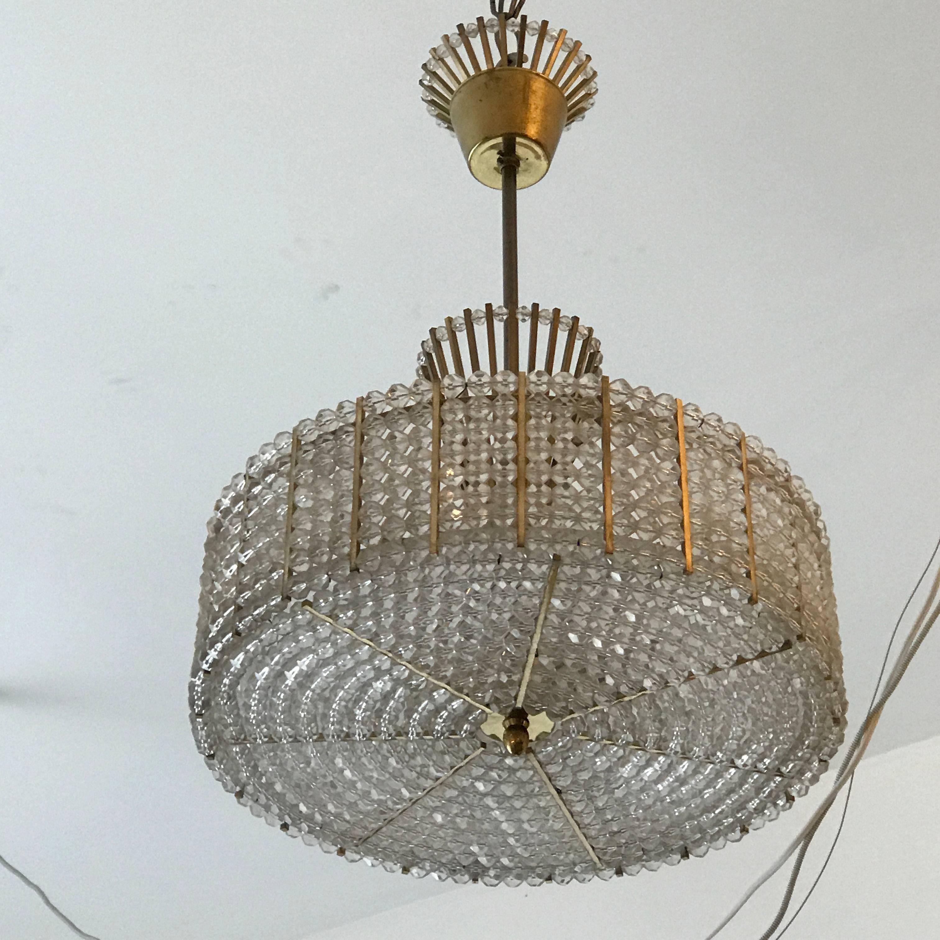 An original 1960s Austrian crystal bead and aged polished brass pendant. Five light sources. Newly rewired.