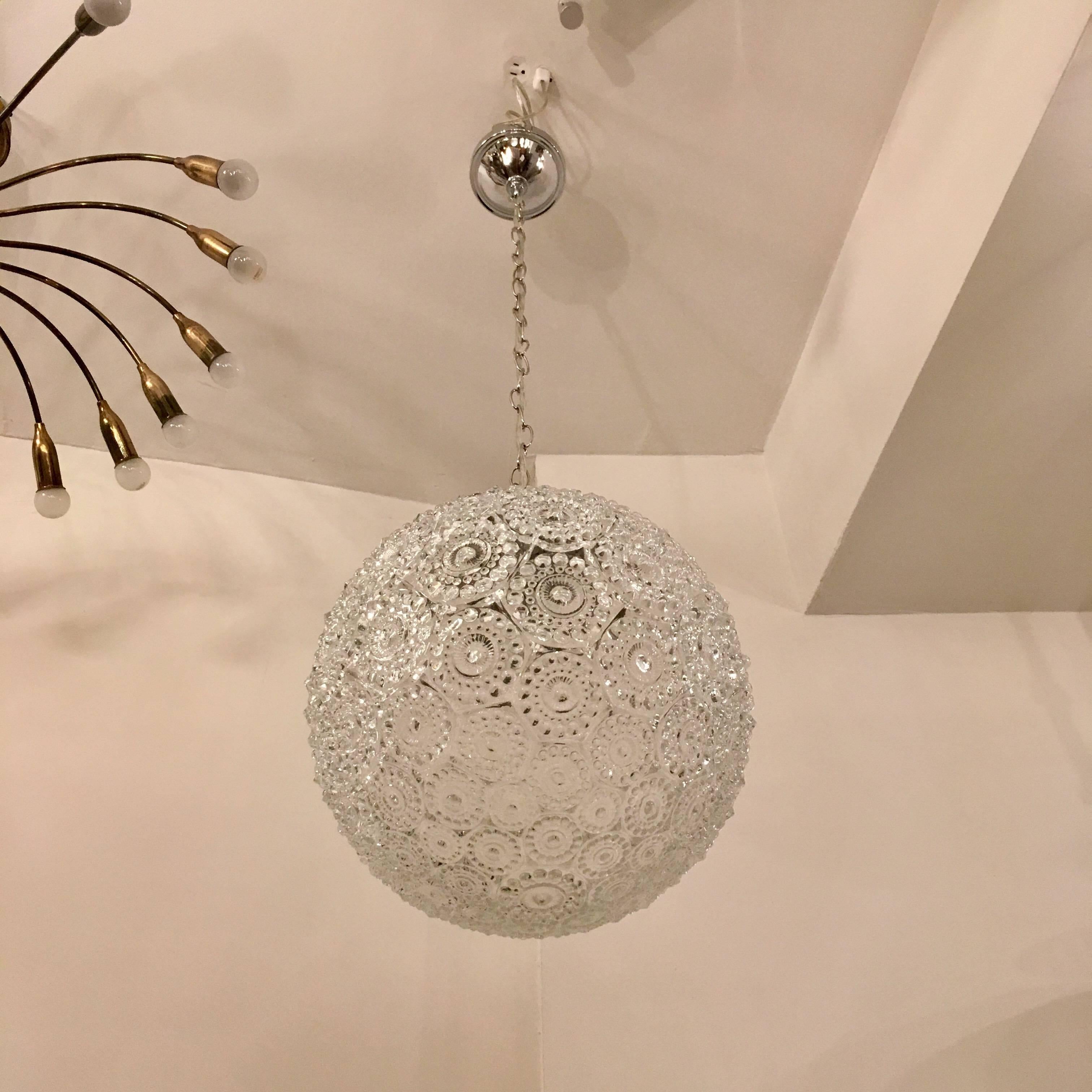A wonderful 1960s Spage Age decorative glass pendant with a polished chrome holder and chain. Newly rewired.