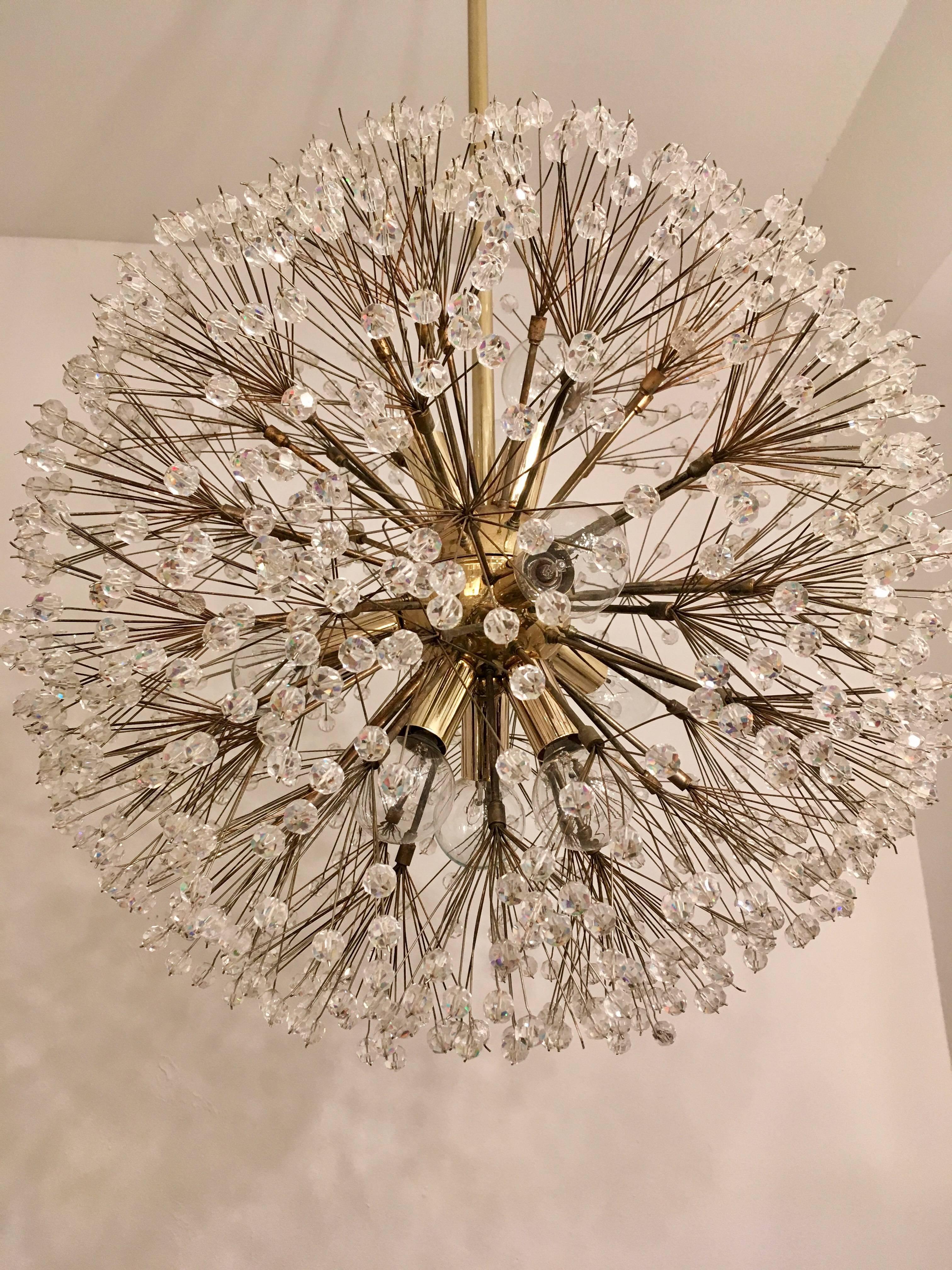 A beautiful 1960s Austrian crystal "Snowflake" chandelier in aged brass with numerous small sparkly crystal . Newly rewired.