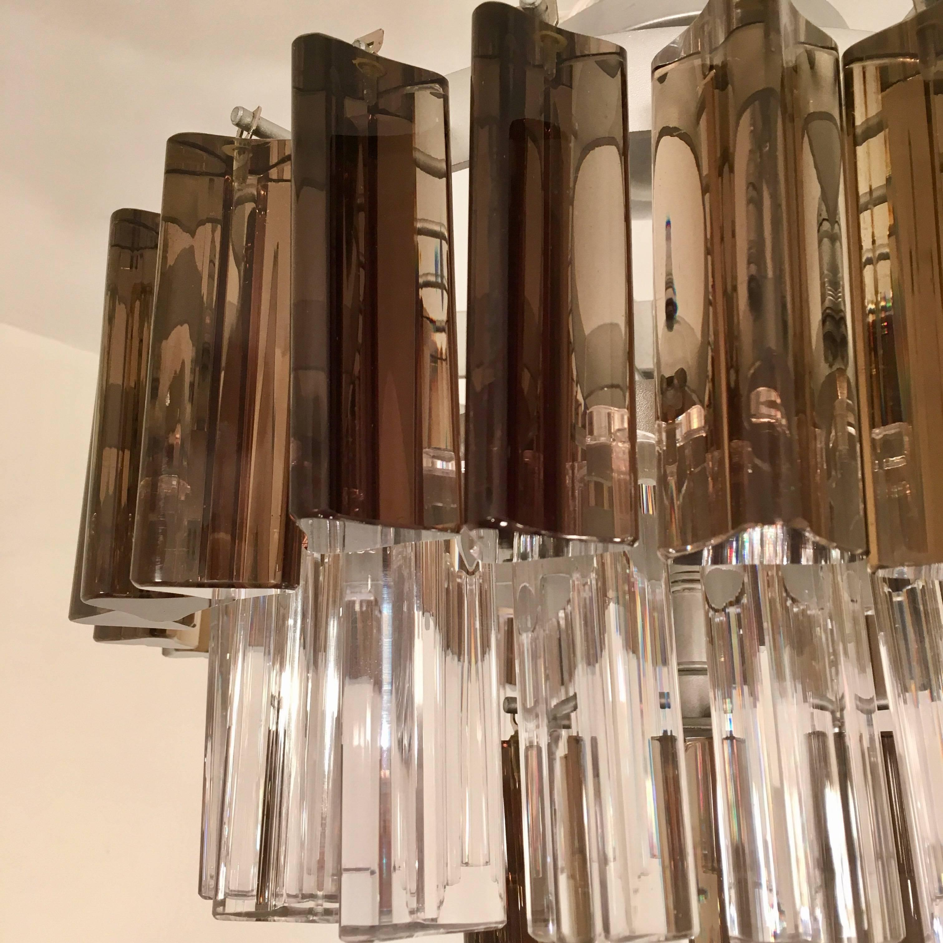 A wonderful pair of 1970s Italian glass pendants or flush lights composed of chrome frames and clear and smoked glass elements. Newly rewired.