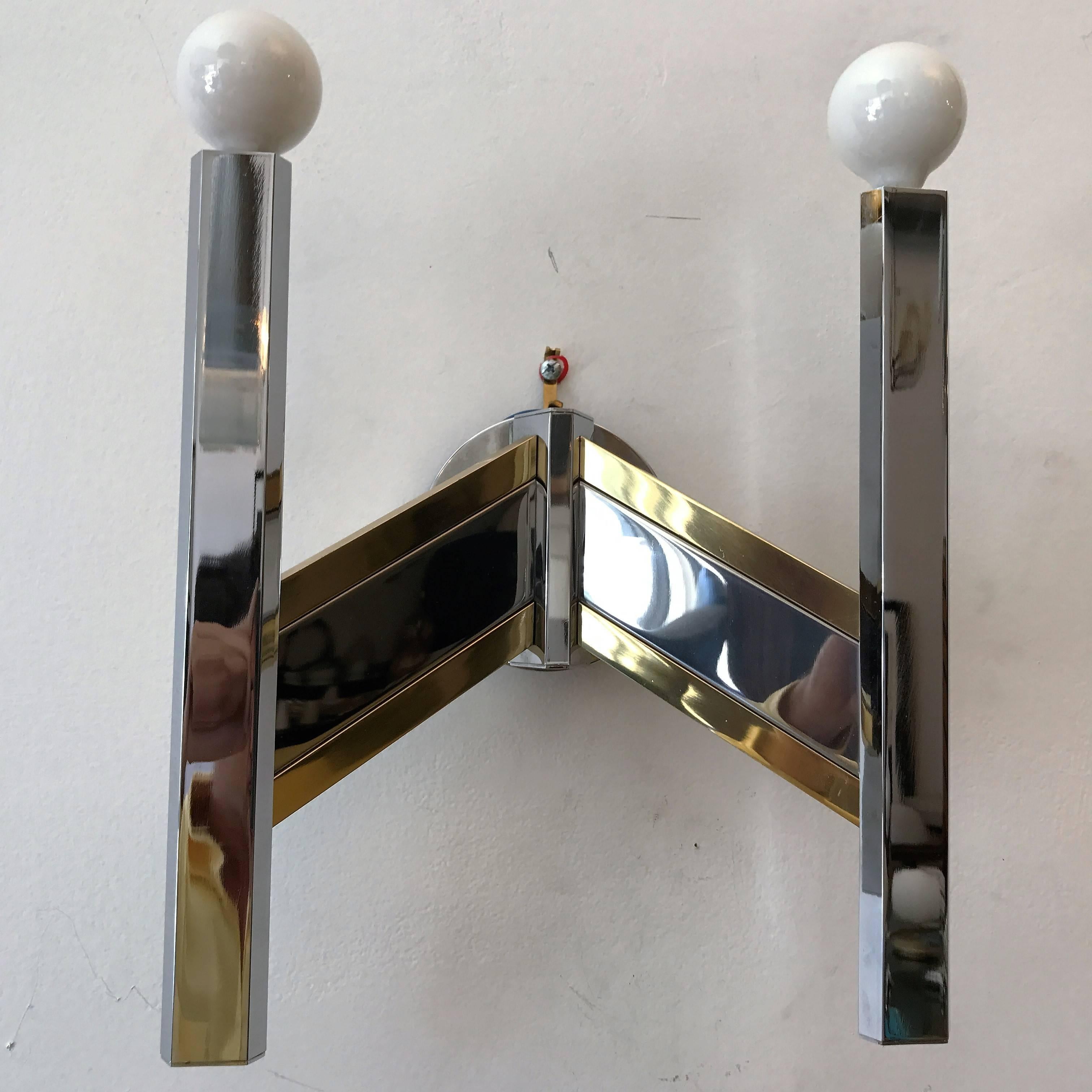 A sleek 1960s Italian sconce in polished chrome and brass by the famed lighting company, Sciolari. Newly rewired.