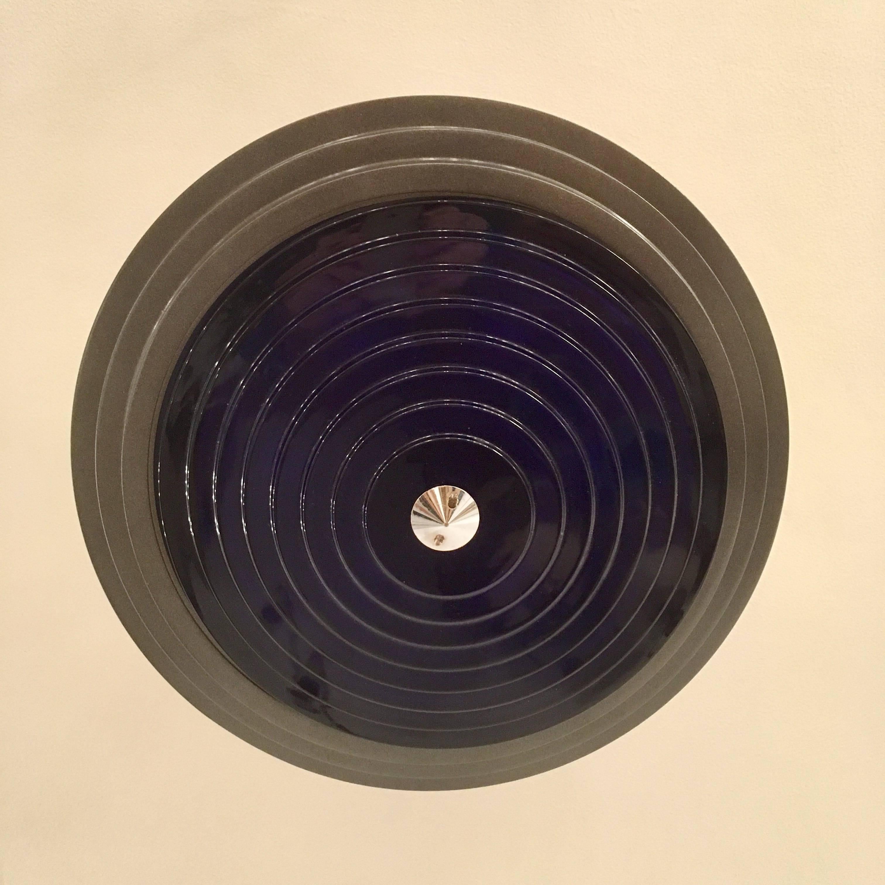 An original 1988 Fontana Arte model # 2792 flush ceiling light composed of a mate gun metal frame and a cobalt blue tiered glass crystal shade with decorative chrome pointed finial. Newly rewired. Signed. Designed by Daniela Puppa and Franco Raggi.