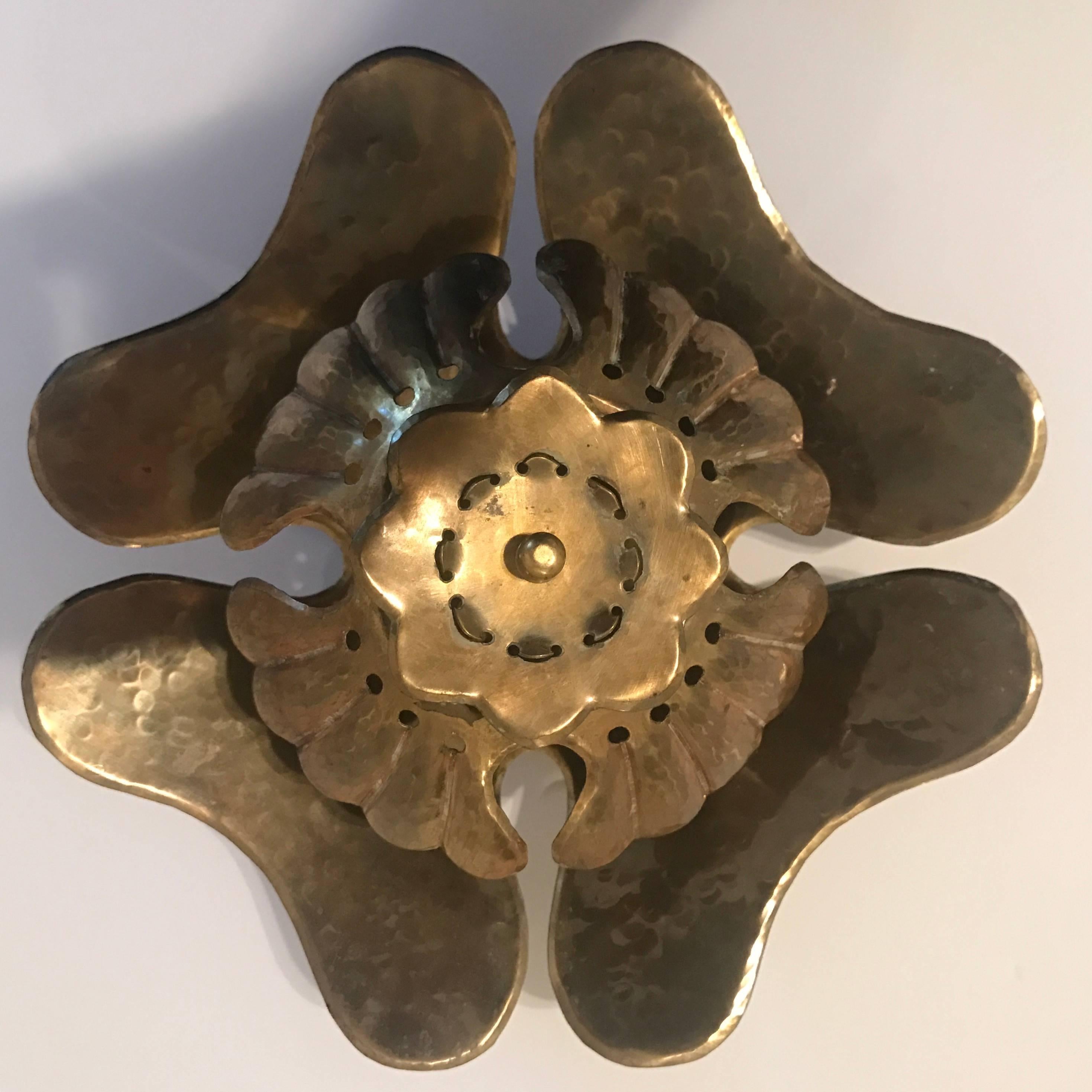 An original 1940 Swedish hand tooled floral brass wall light designed by Lars Holmstrom for Arvika. Newly Rewired . One 60 watt candelabra socket. Signed . Original patina. 6" deep from the wall.

Biography:
Lars Holmstrom was a Swedish