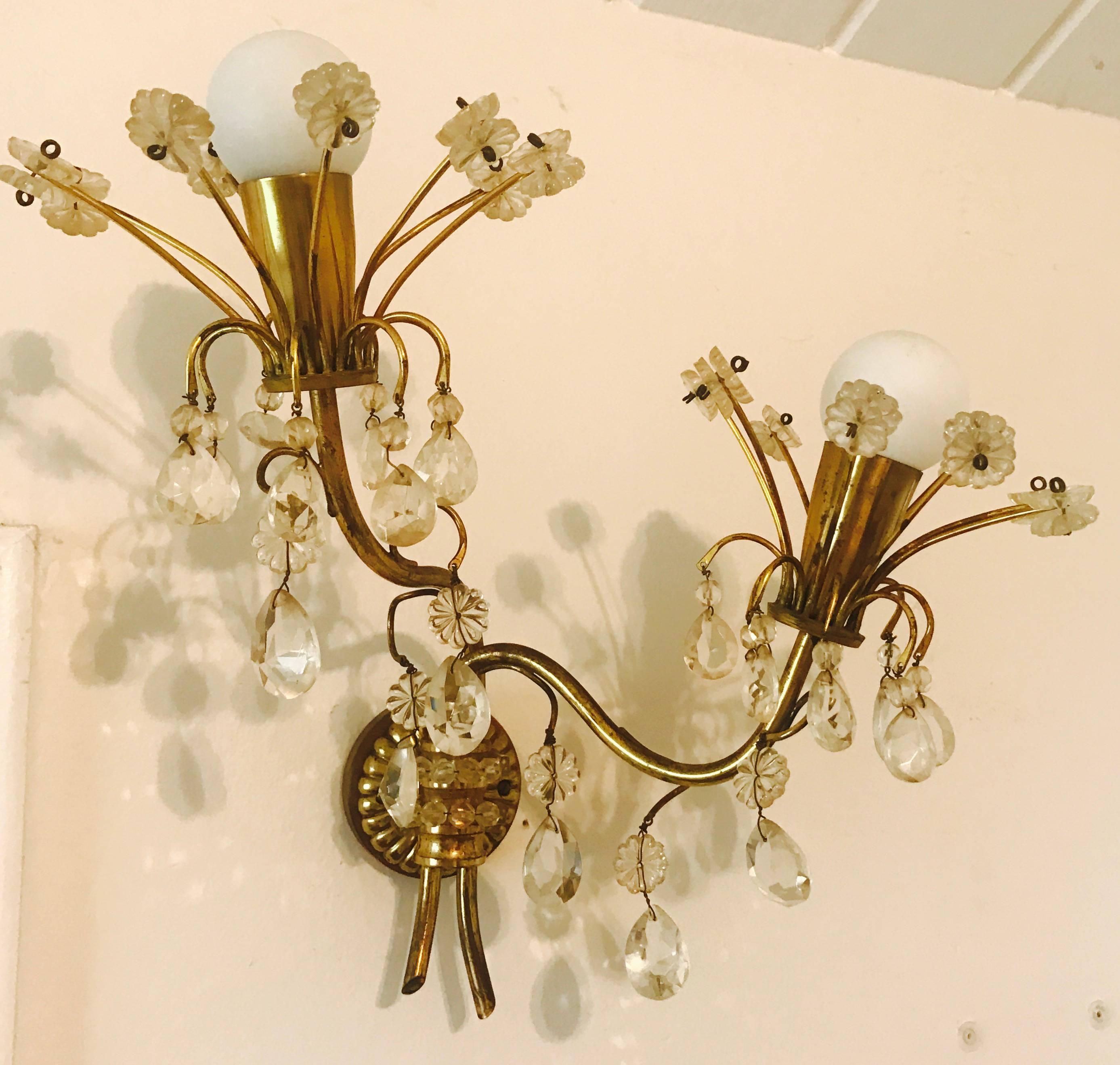 A wonderful 1950s Austrian crystal and aged brass flowing wall light by Emil Stejnar. Newly rewired.