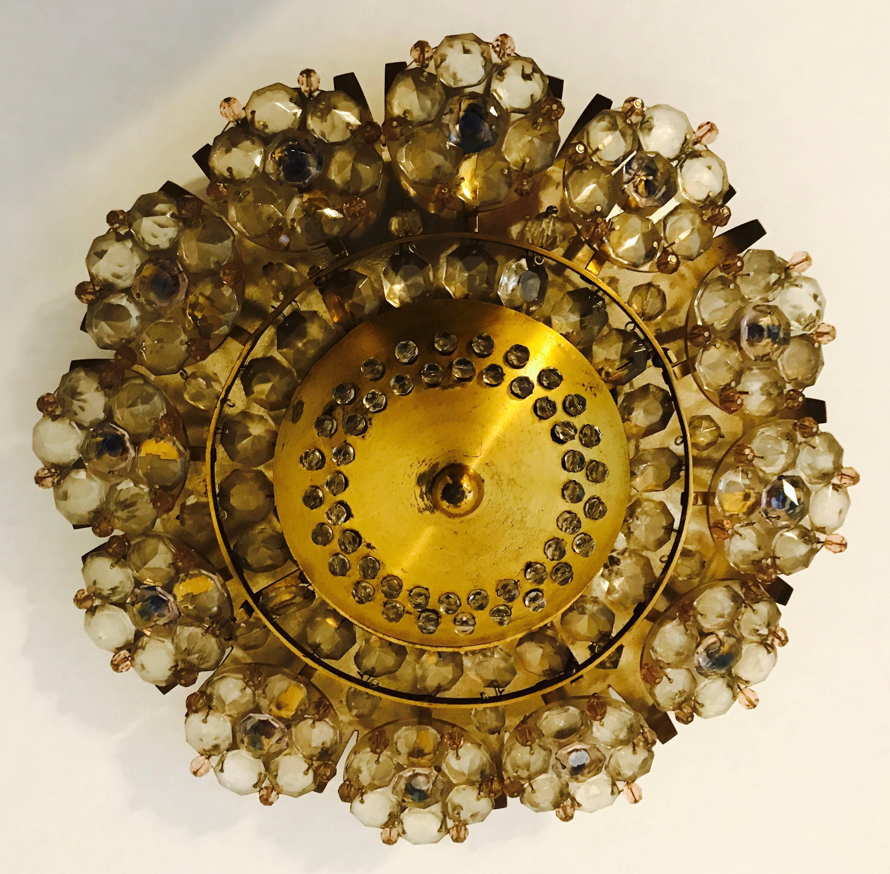 A golden brass and clear and light amethyst color crystal flush ceiling or wall light by the Austrian lighting company, Stejnar. Newly Rewired. Two-light sources.