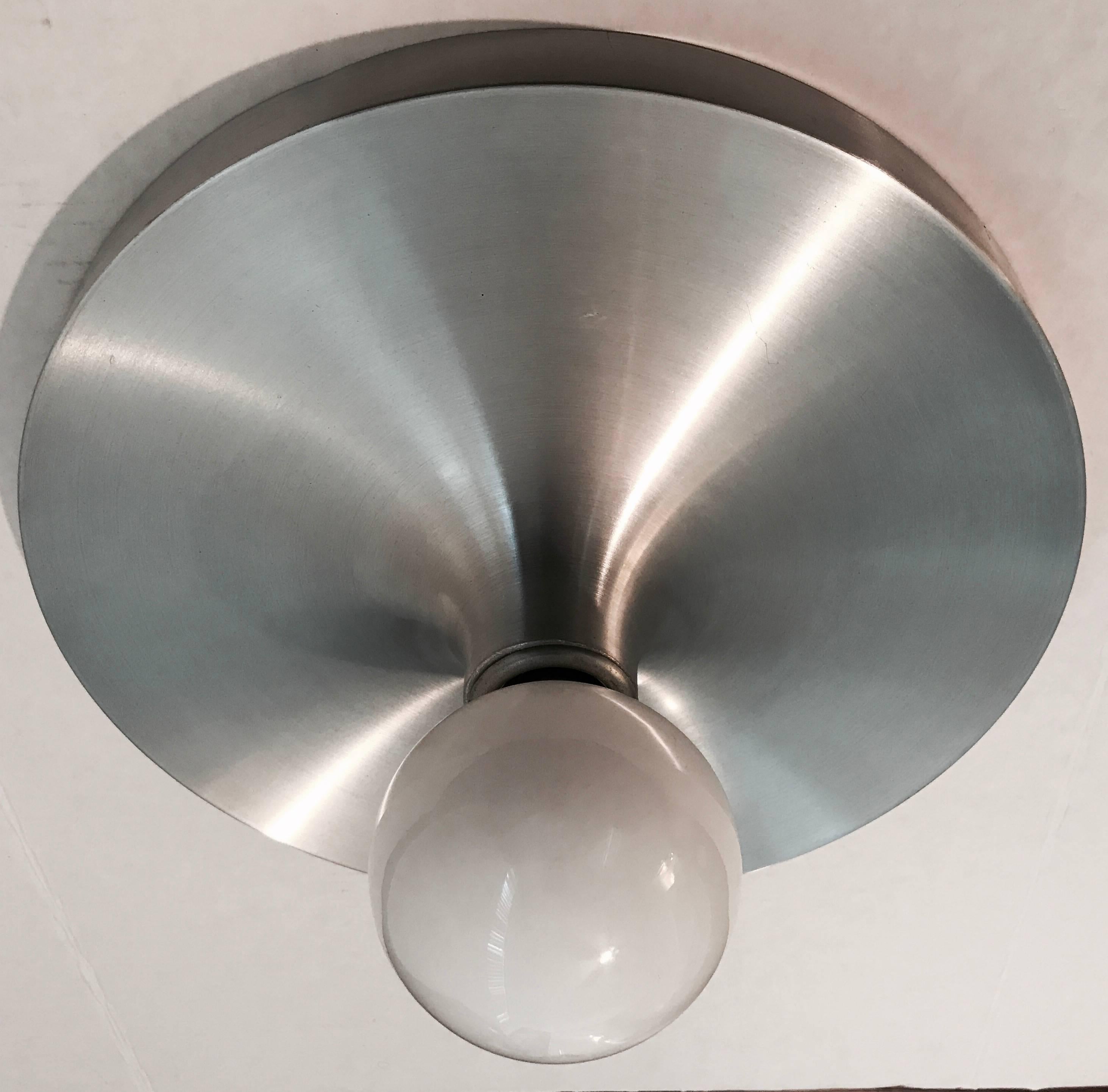 An original 1960s spun aluminum German Space ceiling or wall light designed by Honsel. Newly Rewired. Used by Charlotte Perriand for Les Arcs Ski resort.
