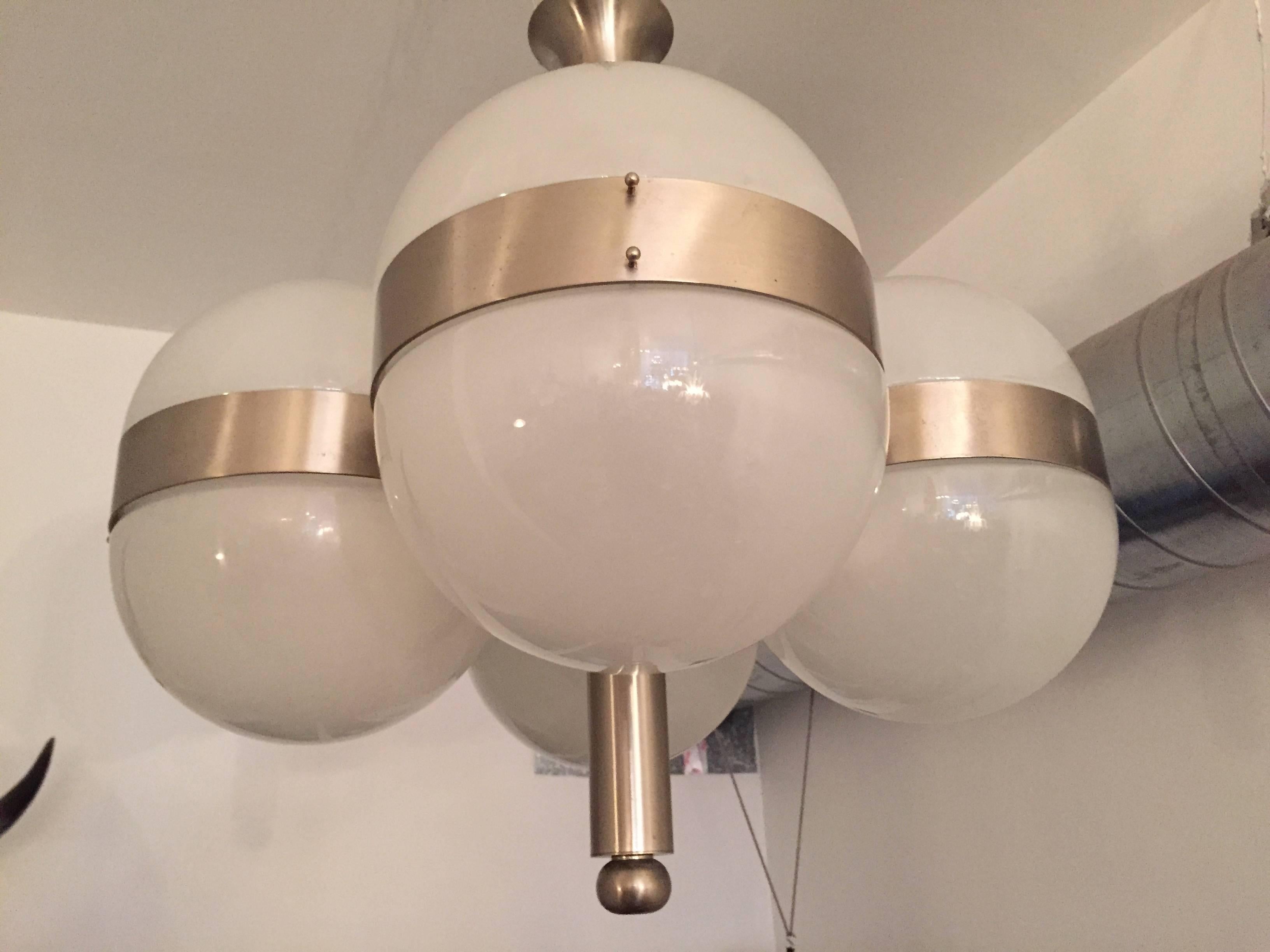 A sleek  modern Italian, 1970s ceiling or hanging pendants composed of a brushed steel fixture with eight opaline glass dome shades. Made by Sergio Mazza for Artemide. Rewired. Located in our New York City Chelsea location.