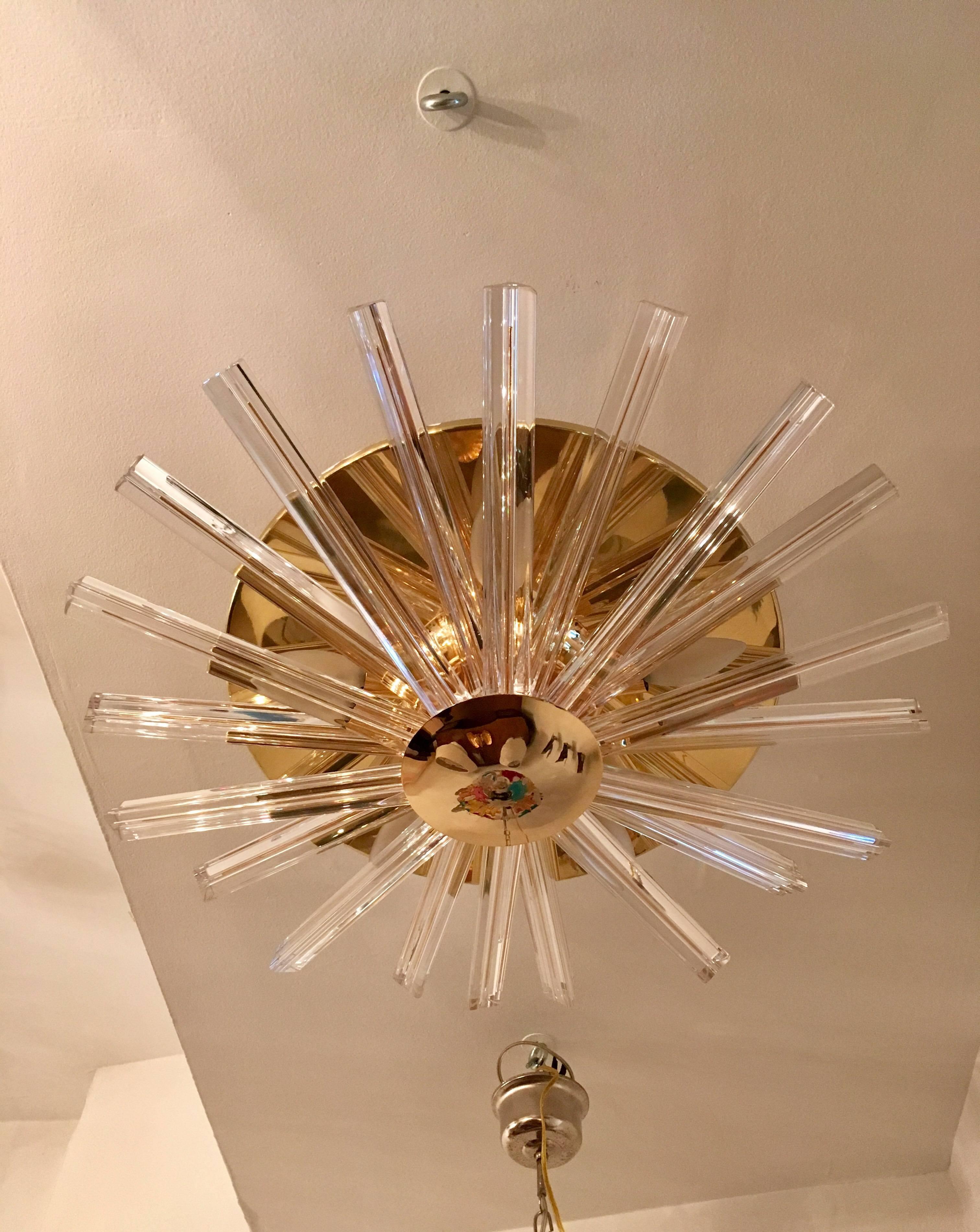 A great 1960s Italian polished brass and thick crystal flush ceiling light. Newly Rewired. Five candelabra sockets.
Located in our New York City Chelsea location.