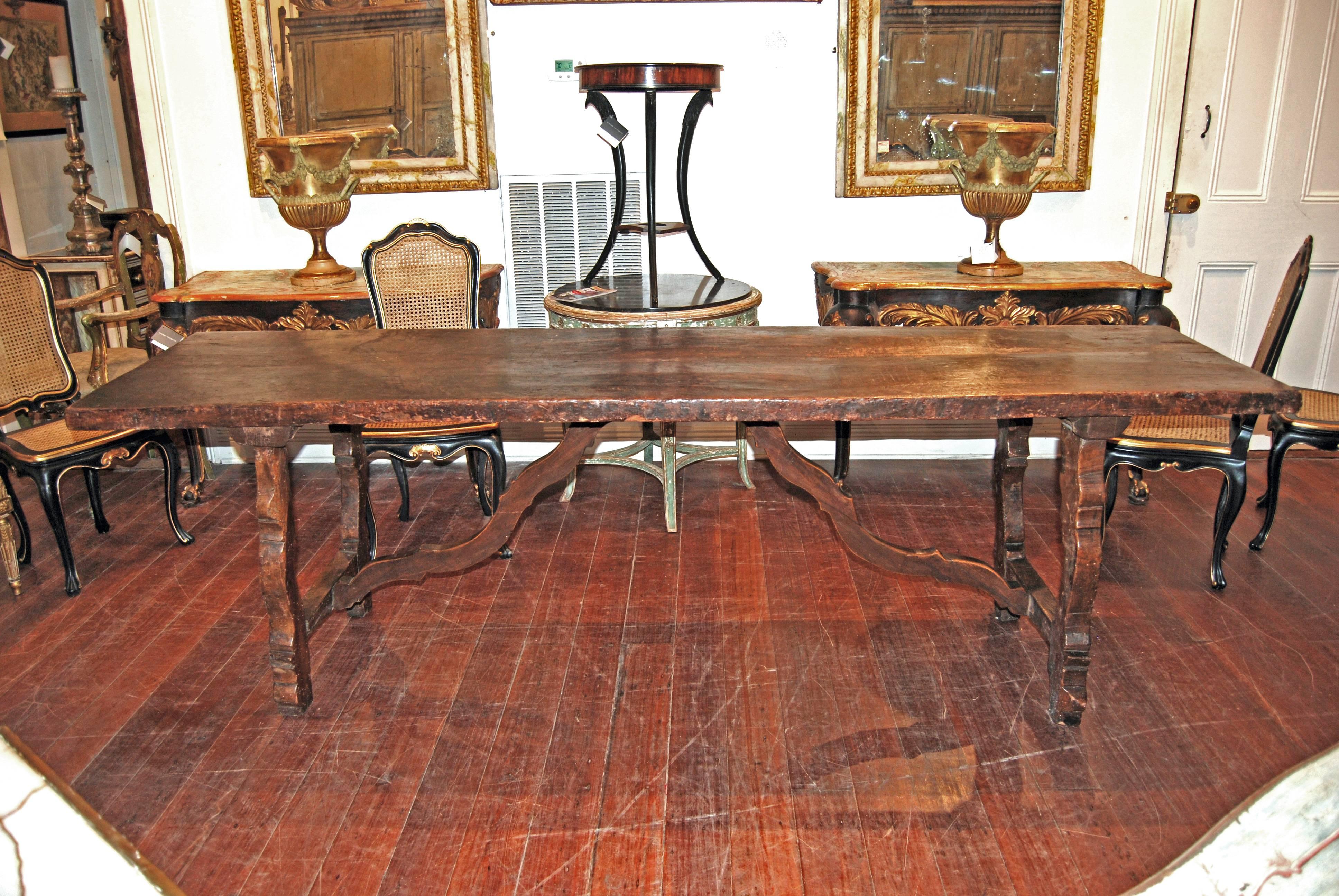 Fabulous 18th century table with original wooden stretcher.