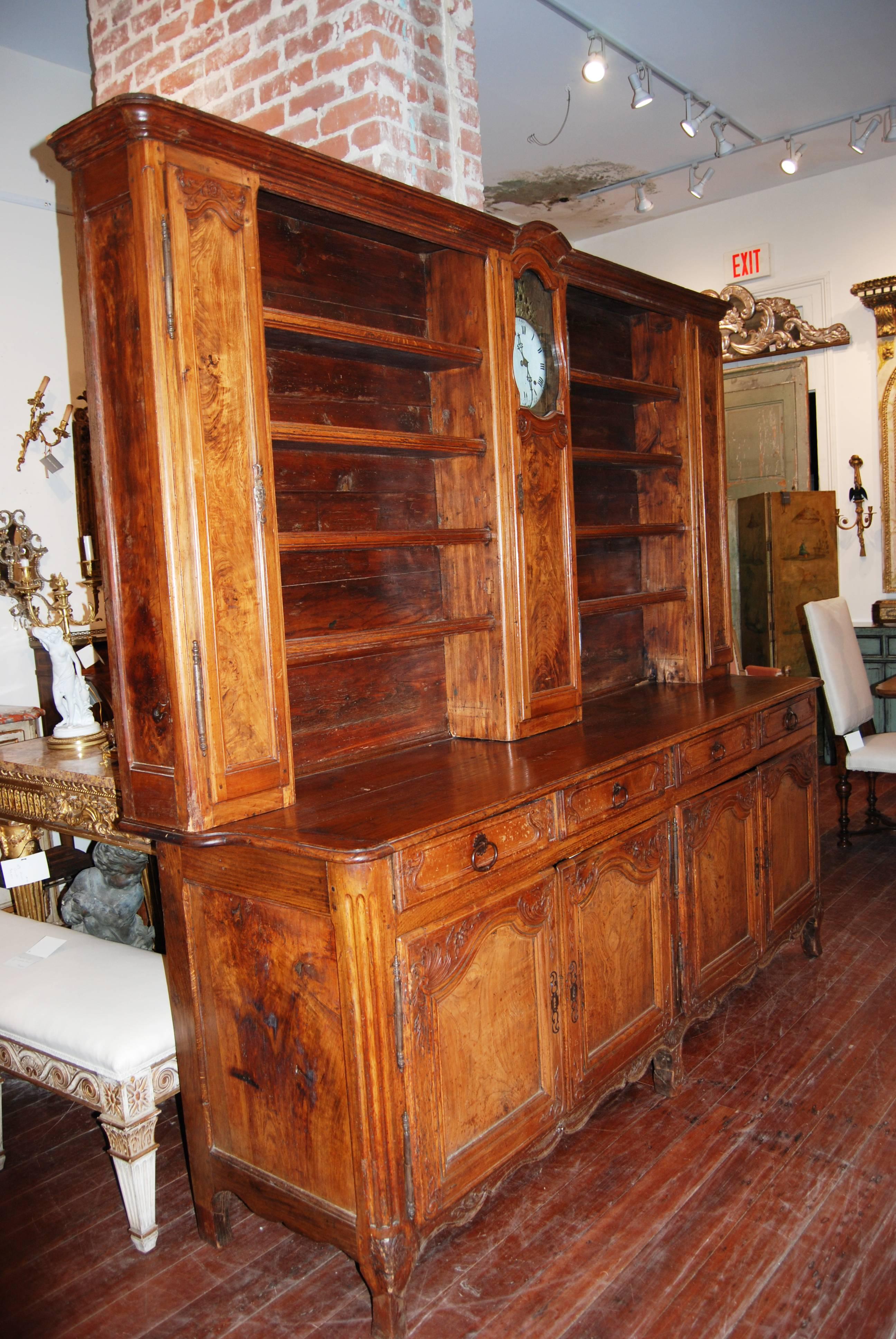Beautiful Rustic French walnut vaisselier with Mobilier clock. Beautiful display area and storage options.