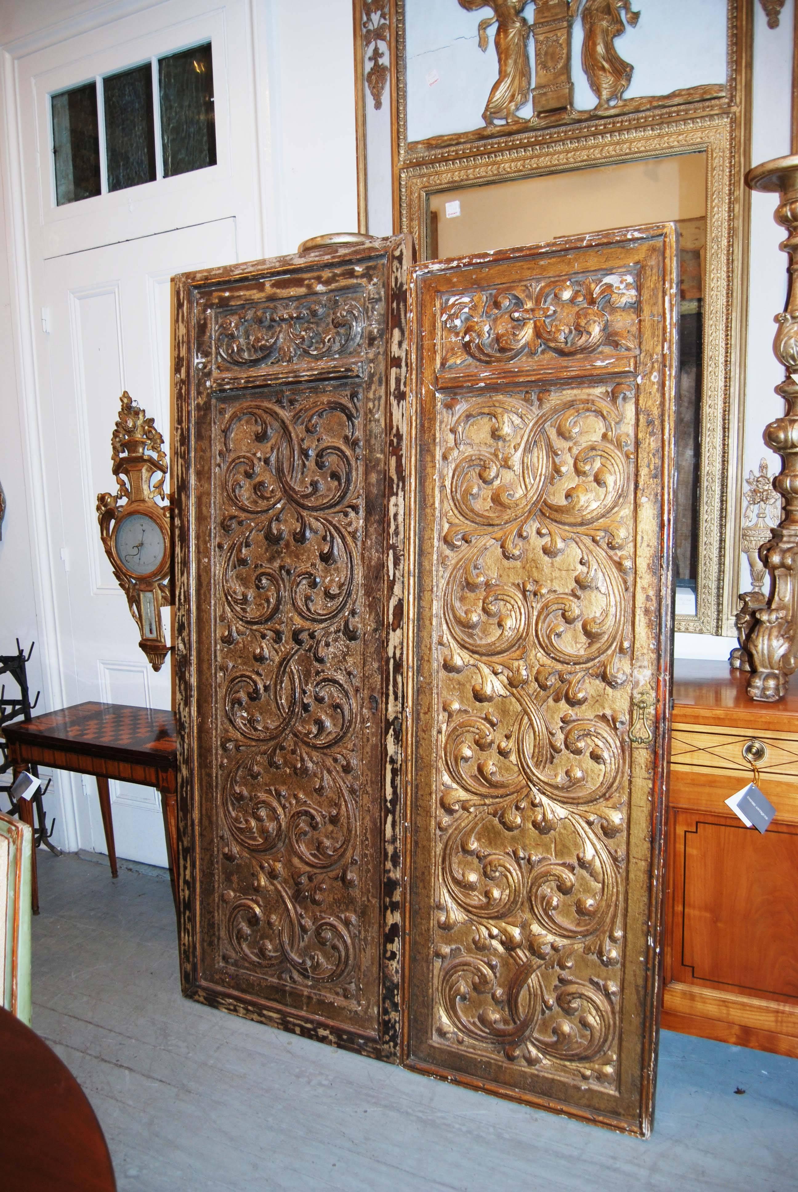 Two beautifully carved and gilded doors. The patterns appear to be the same but the size differs.
Largest door
Measures: 82 high
28.75 wide
2 depth.