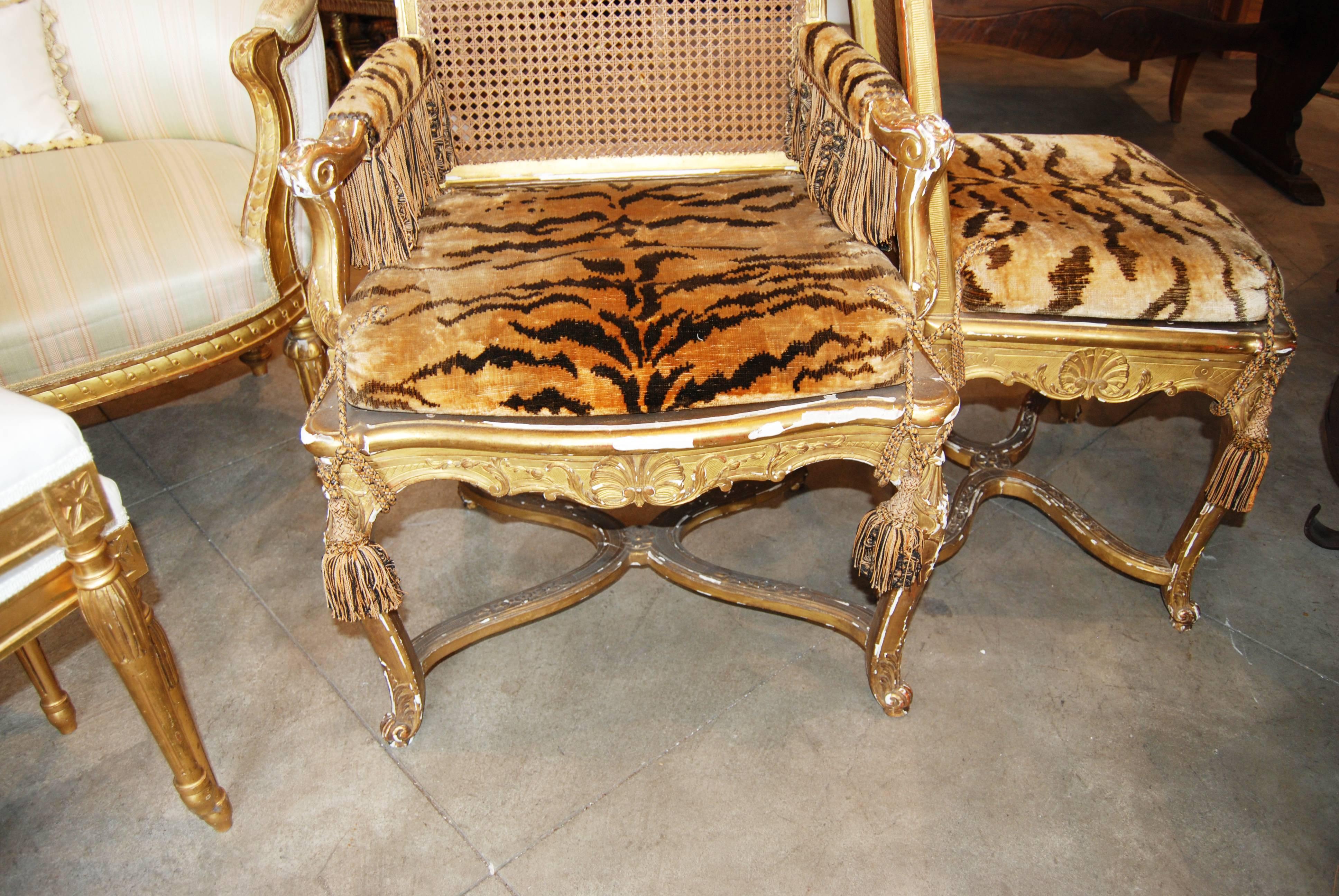 Set of 12 giltwood chairs comprised of six armchairs and six side chairs.