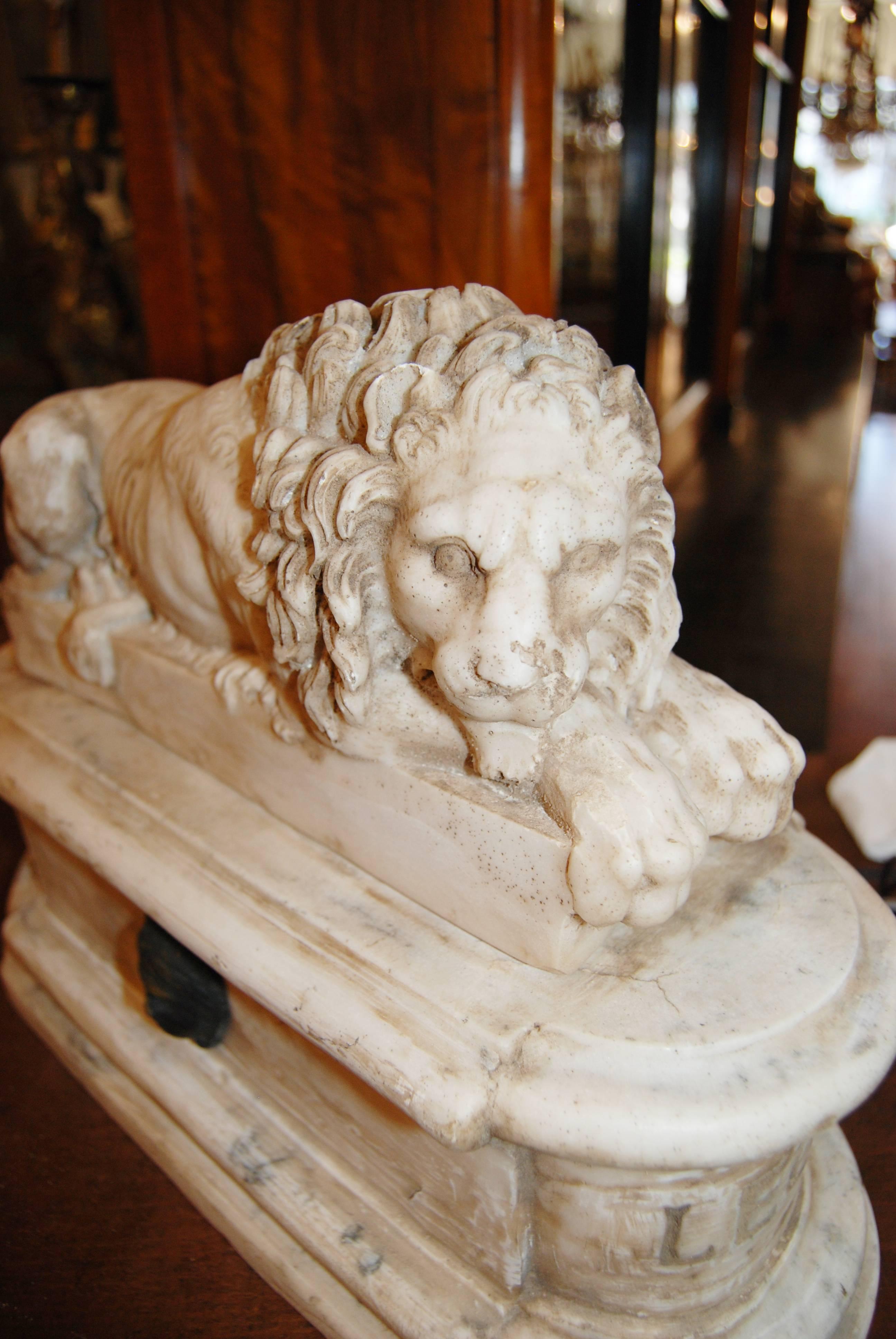 Pair of Carved Marble Lions on Marble Stands In Good Condition In New Orleans, LA