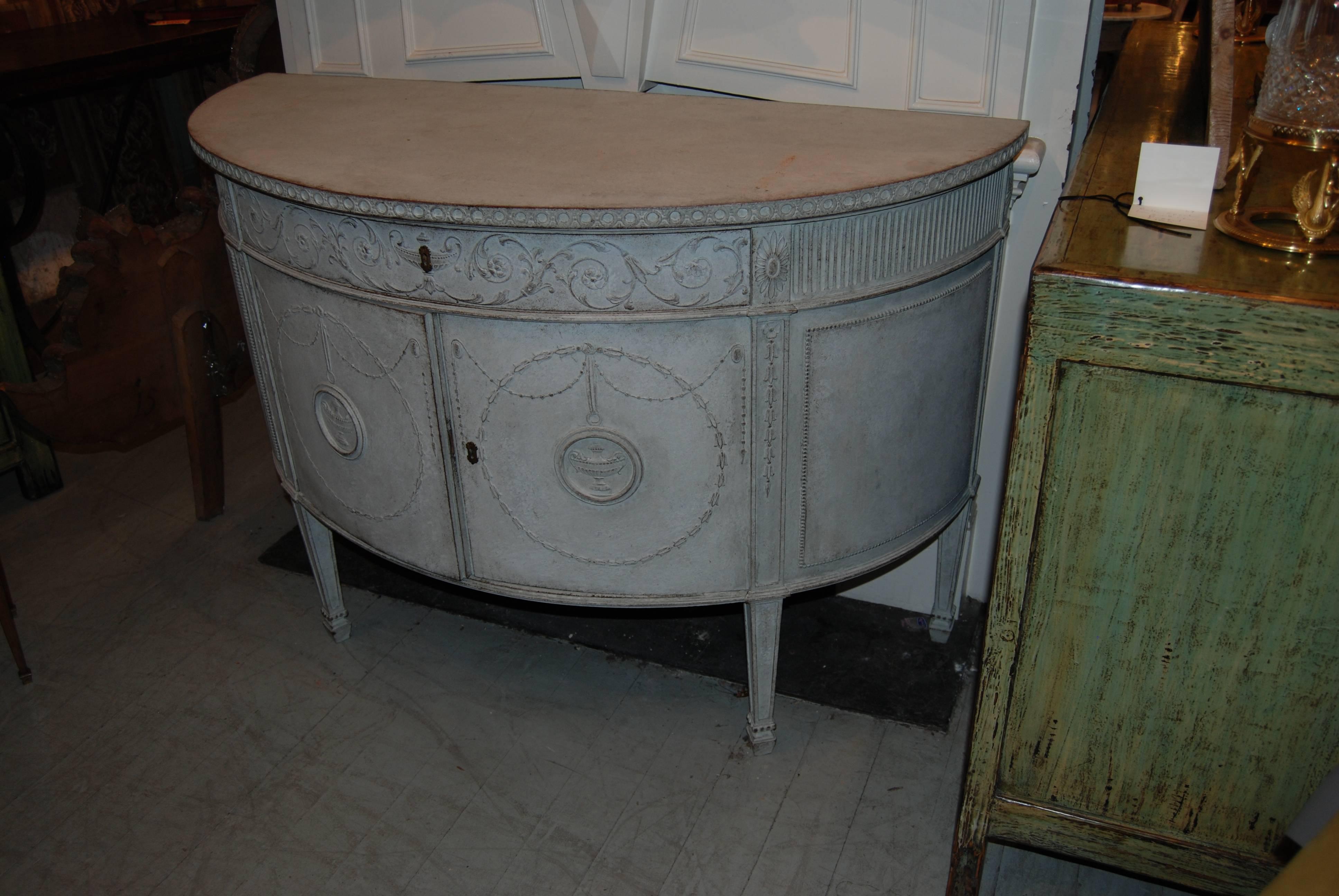 Beautiful painted and carved demilune buffet.
