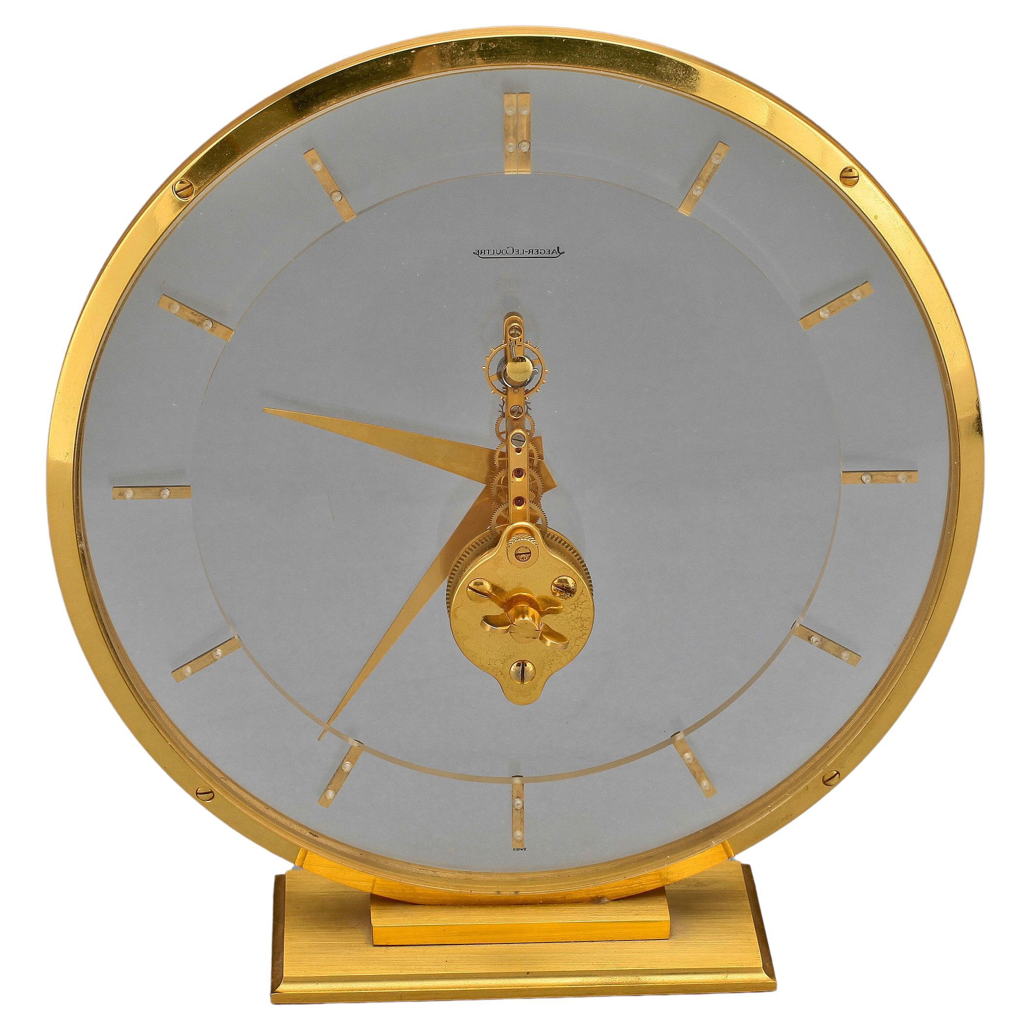 Very rare lucite and brass round skeleton clock from Jaeger-LeCoultre, with a clean, minimalist design that fits any environment. The beauty of these skeleton clocks is its transparency,  you can see the 16-jewel Swiss movement running and watch the