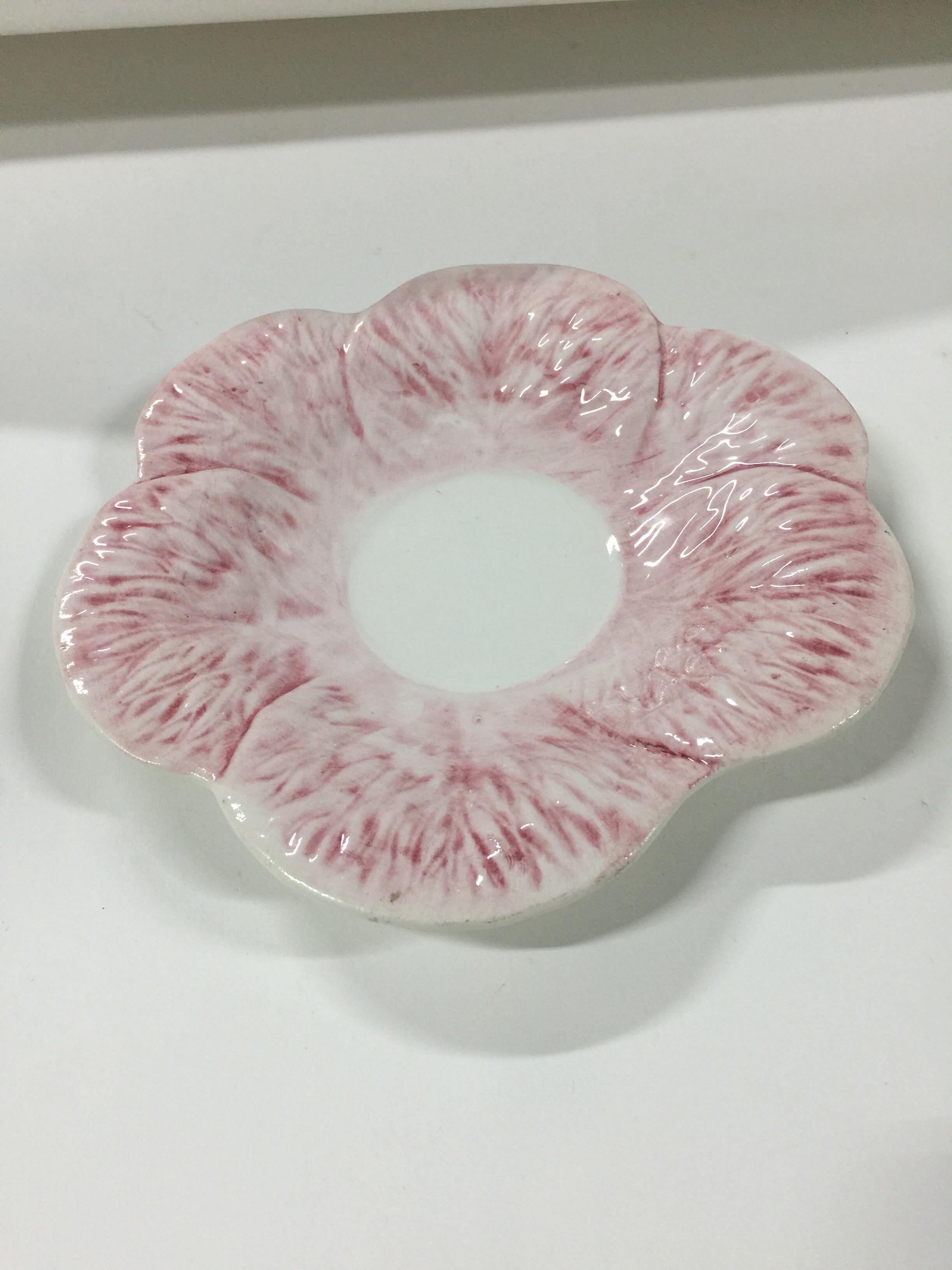 A Majolica porcelain dish in the pink cabbage pattern by Mottahedeh. Signed. Made in Italy, circa 1940-1950.

Measures: 8 inches in diameter.