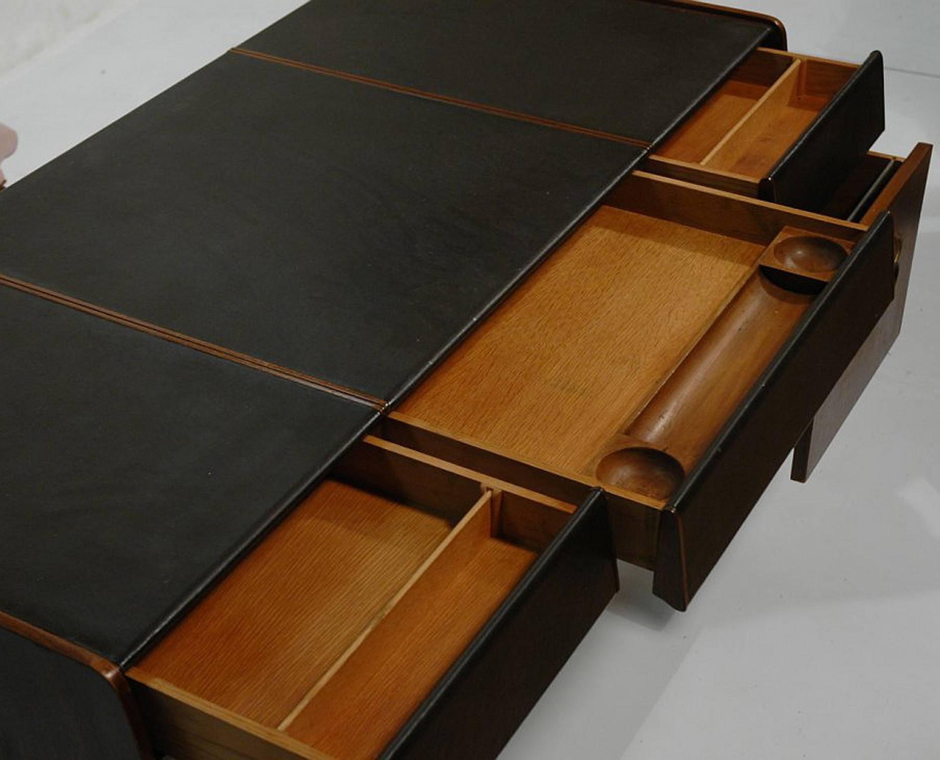 Well designed desk by Bert England for John Widdicomb. The desk has a total of 5 pull out drawers, decorative bronze handles and a finished back should you wish to float the desk. Perfect with modern, traditional or decorative decor