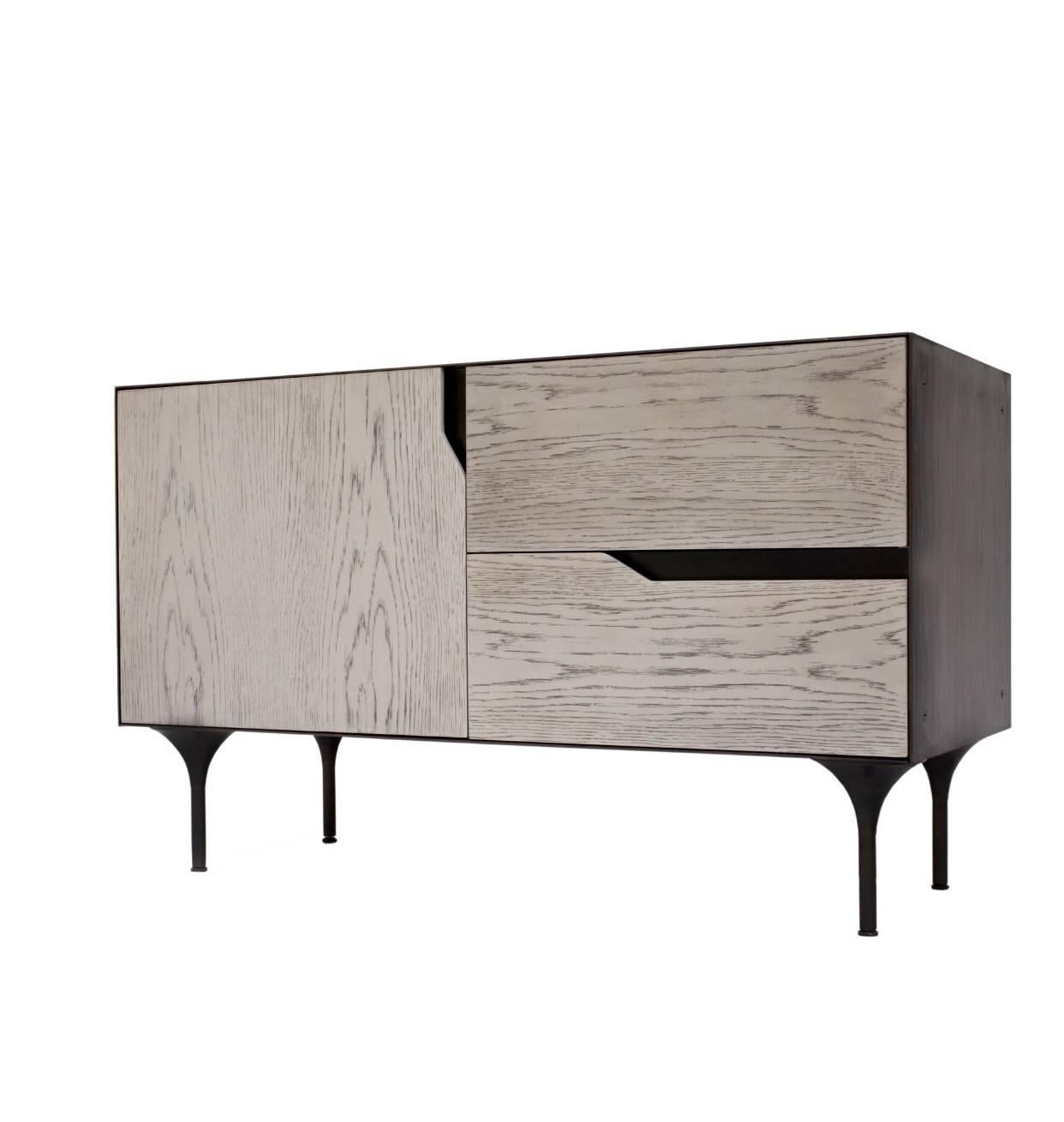 Inspired by the Greek legend, the Titan junior credenza, in a shorter length than our original namesake model, projects a masculine aesthetic given by the use of materials and its proportions, a heavy steel carcass embraces a wooden body, all