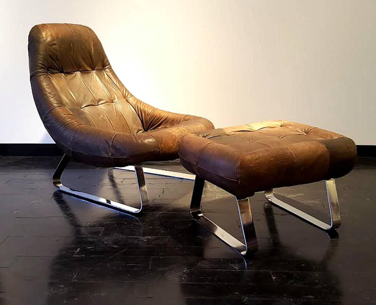 Brilliant Brazilian architect and designer Percival Lafer designed this scrumptious Earth lounge chair with matching ottoman Both are covered in the most perfectly patinaed leather. Chair is soft and very comfortable and the chrome is shiny and
