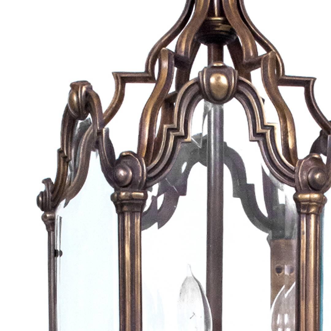 An exceptional pair of antique bronze lanterns with six glass panels and three candelholders, USA, circa 1890, possibly earlier. Electrified; takes three candelabra bulbs.
  