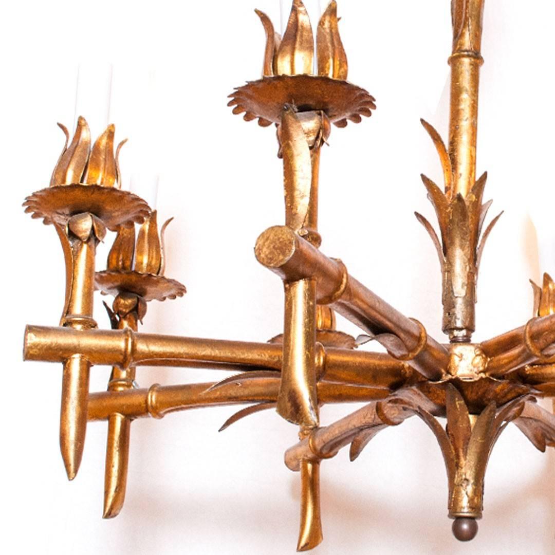 Hollywood Regency-style brass faux-bamboo chandelier with eight arms, USA, circa 1960s. Includes canopy.
 
