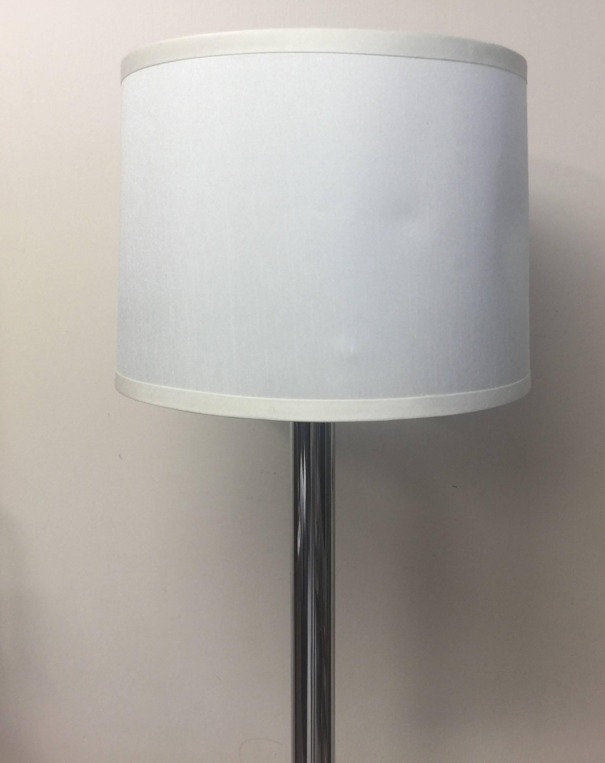 A polished chrome floor lamp with thick round base and cylindrical stem, USA, circa 1970. Unsigned.

Polished chrome floor lamp with round base. AMERICAN, circa 1960-1970.

Unmarked; similar in style to lamps by Sonneman, Nessen and