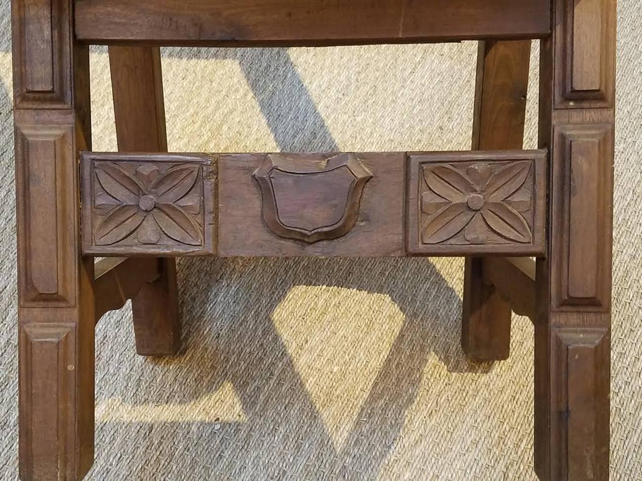 A very handsome set of 1920s, Spanish Colonial style dining chairs. Made from hand-carved wood and beautifully patinated leather, these chairs add character and warmth to any interior.