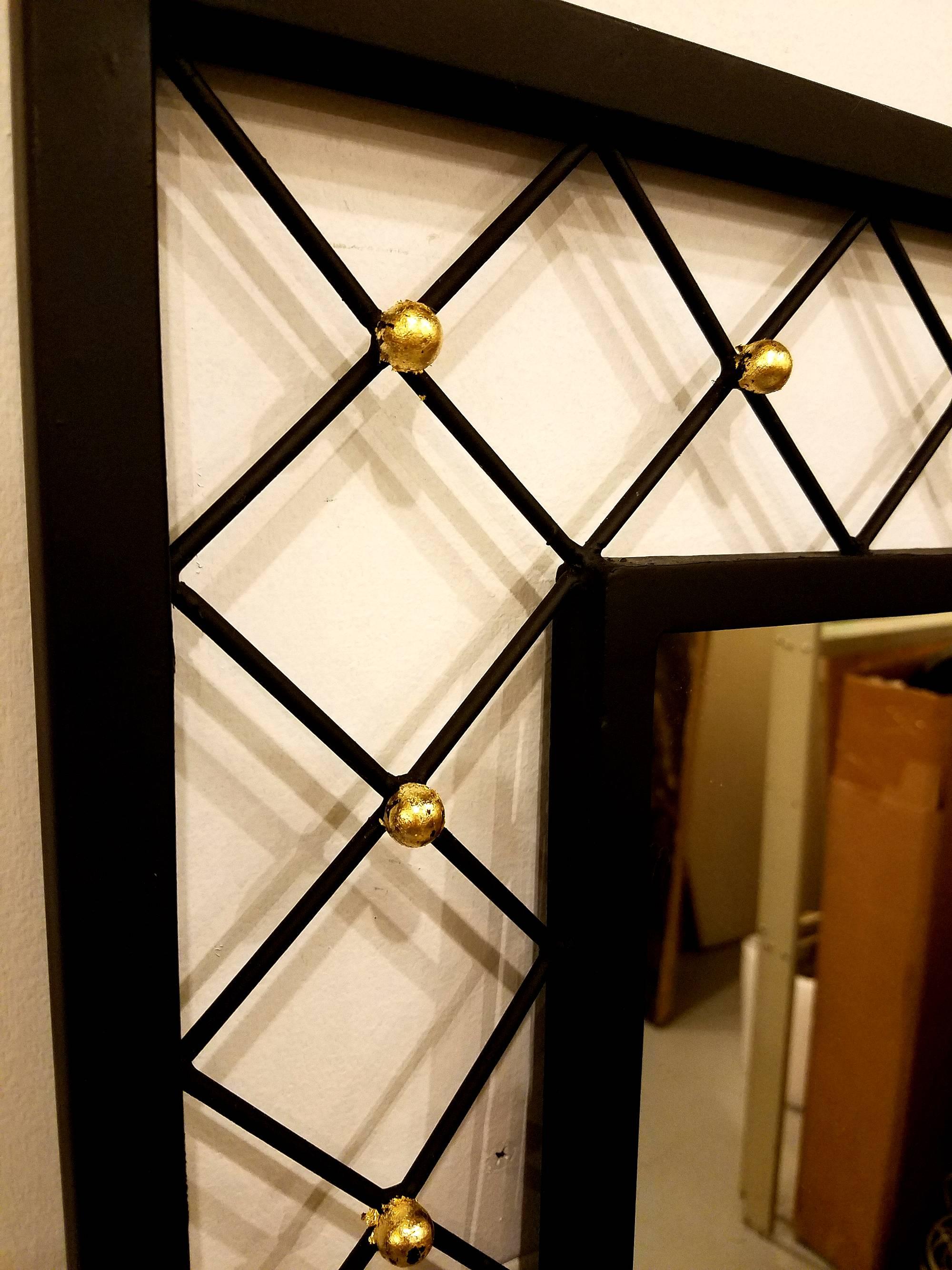 Very beautiful matte and gilded iron mirror in the style of Jean Royère, American, circa 1950s.