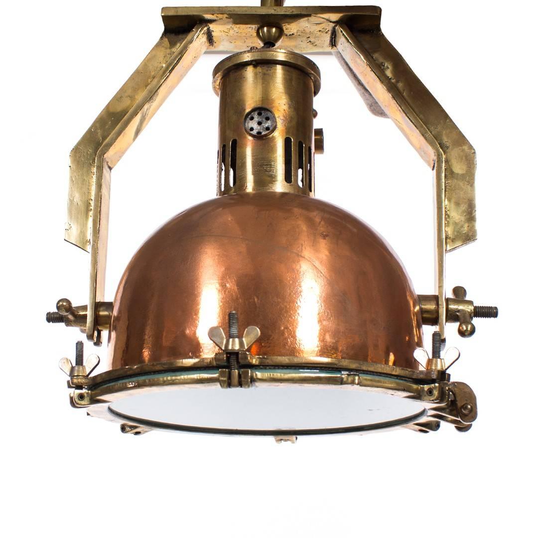 A vintage Industrial copper heat pendant light fixture, USA, circa 1950. Rewired for U.S. Overall height with stem is 31 inches; stem length may be shortened for an additional fee (contact us for details and with desired total drop