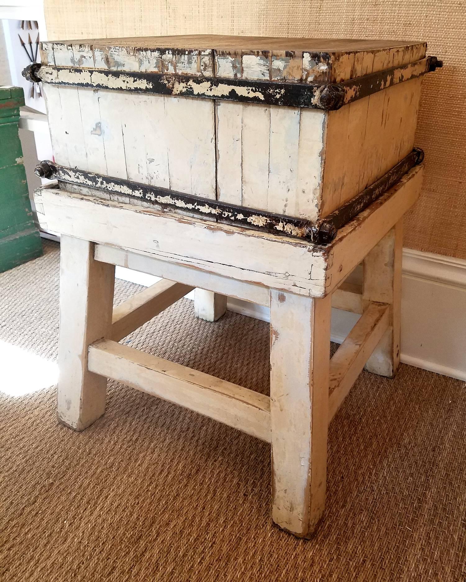 Such a wonderful piece, and with such character. French circa 1900, the French oak top is strengthened by the hand-wrought iron belting. The block can be removed for easy transportation. Great patina on the milk paint surface, iron workings and the