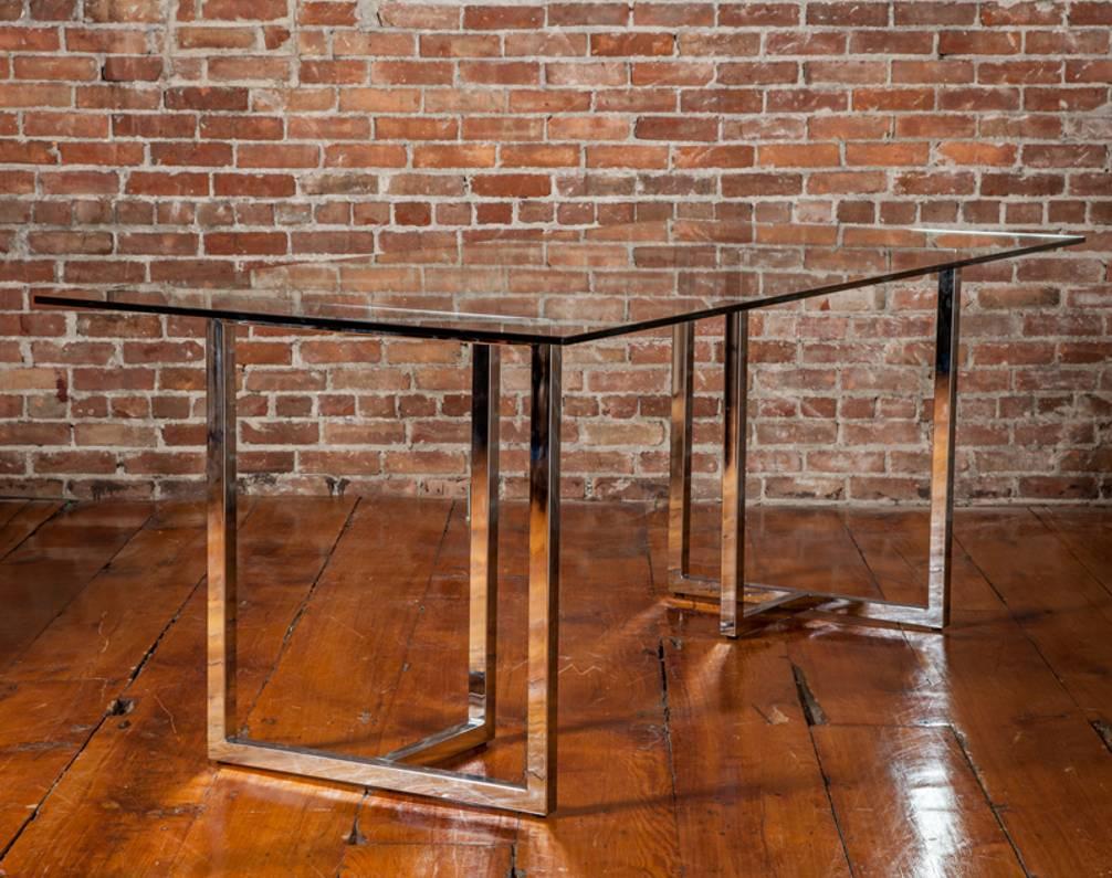 A simple piece, much like the little black dress. Chrome is in excellent condition and glass is flawless. It can either be used as a dining table or it would make an excellent desk.

Should this glass be to large at 80 inches in length we have a