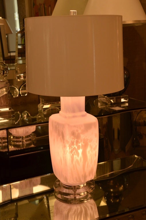 Striking and unusual Mid-Century lavender Murano glass table lamp. The lamp has a three-position switch so you can either light the lamp, the lamp body or both. When the lamp body is lit it gives off a beautiful lavender color. The lamp is set on a