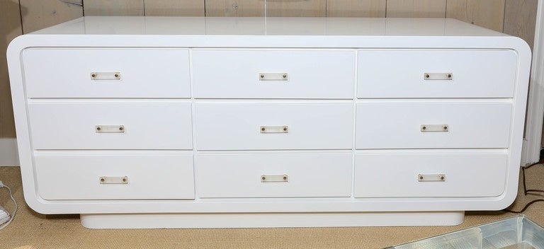 Beautiful Mid-Century white lacquer nine-drawer commode with Lucite drawer pulls.