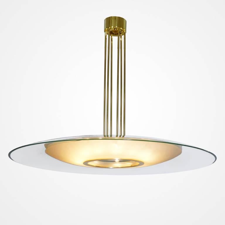 Very large chandelier by Max Ingrand for Fontana Arte, Italy, circa 1960. Clear disc over satin finish diffuser. Suspended by six brass rods with canopy.  Rewired and restored, takes 15 candelabra bulbs.
Documented, model number 1498 .
Measures: