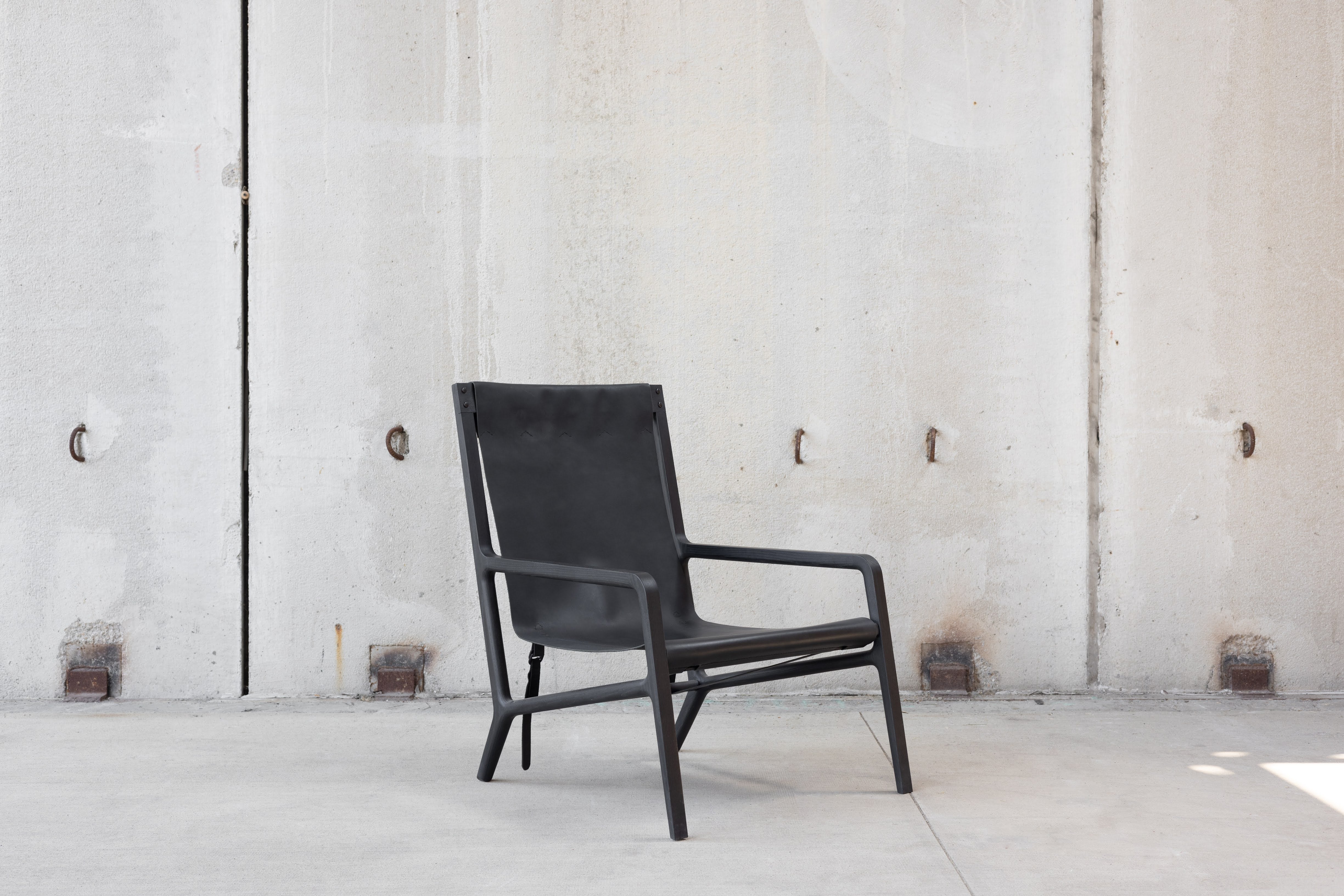 This leather lounge chair was made to make a dynamic appearance in any space and to be a go to lounge chair for reading and relaxing. The original design was built and tested over and over again making small changes to dimensions, construction
